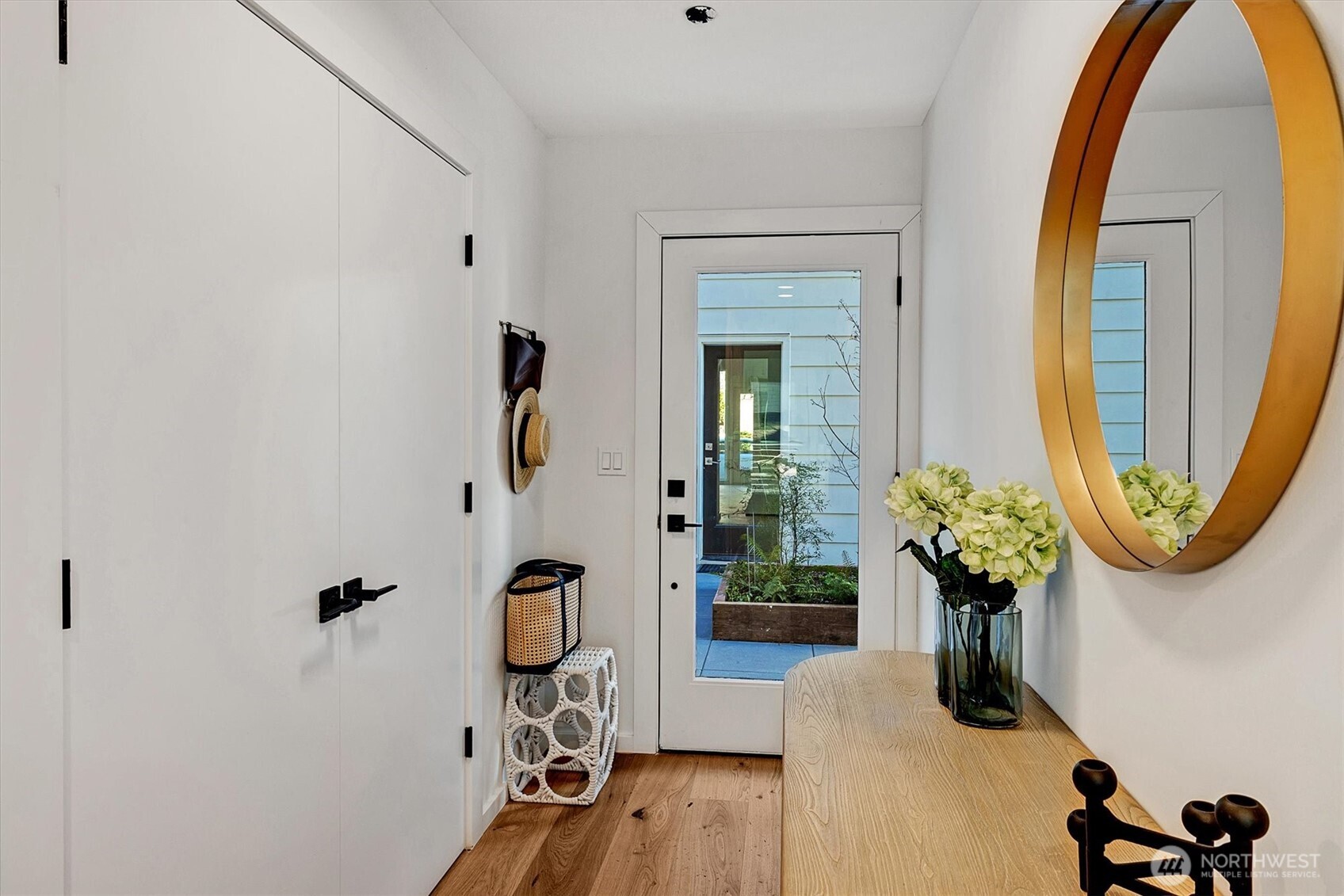 1227 East Roy Street Seattle, WA 98102 - Photo 3 of 35 a view of a porch with a potted plant