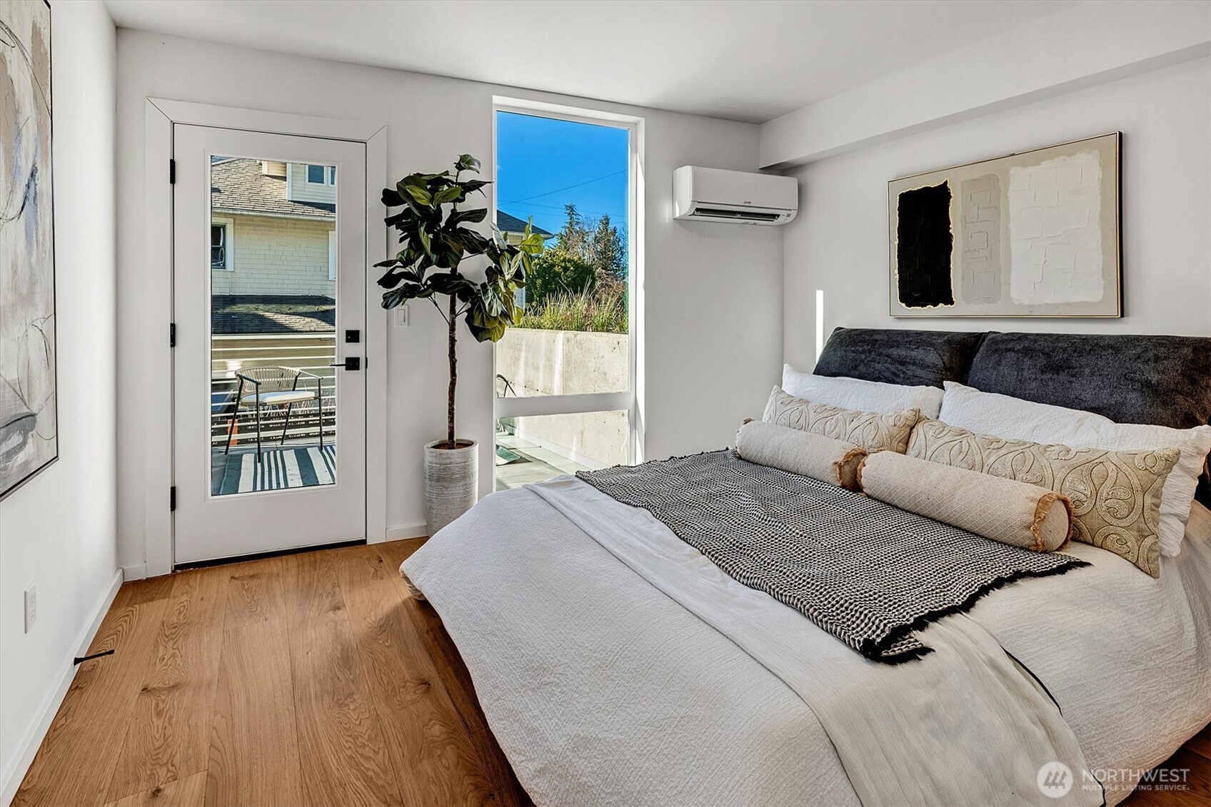 1227 East Roy Street Seattle, WA 98102 - Photo 4 of 35 a bedroom with a bed and a large mirror