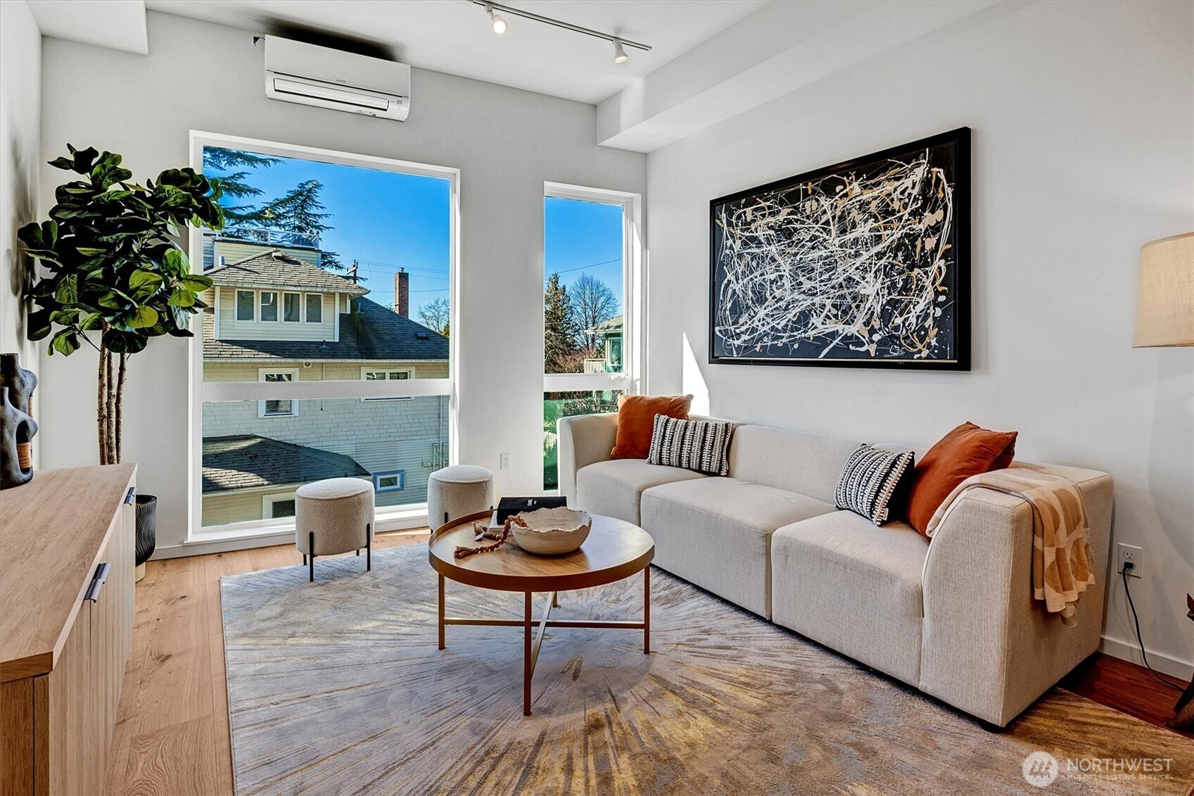 1227 East Roy Street Seattle, WA 98102 - Photo 8 of 35 a living room with furniture and a potted plant