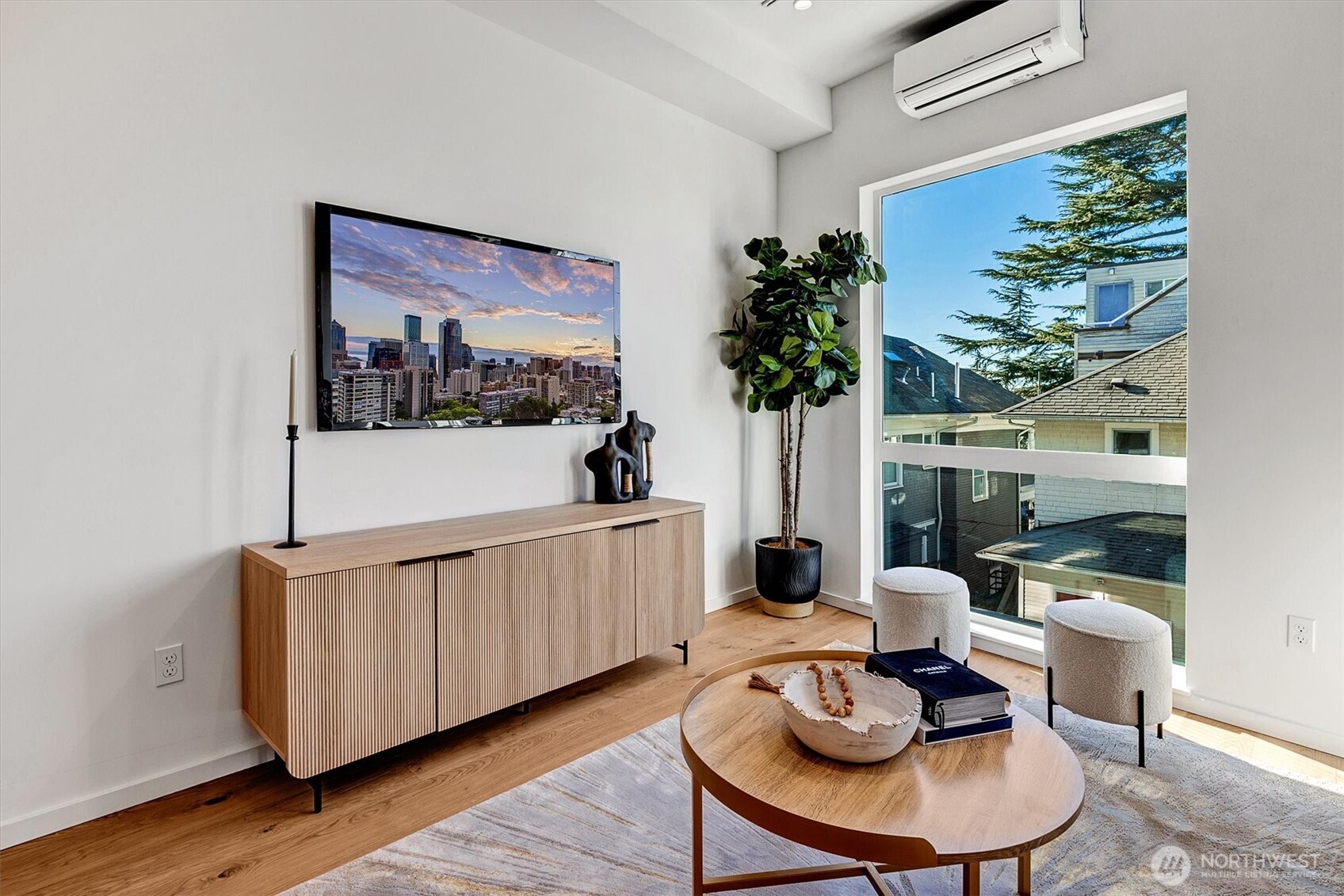 1227 East Roy Street Seattle, WA 98102 - Photo 9 of 35 a living room with furniture and a potted plant