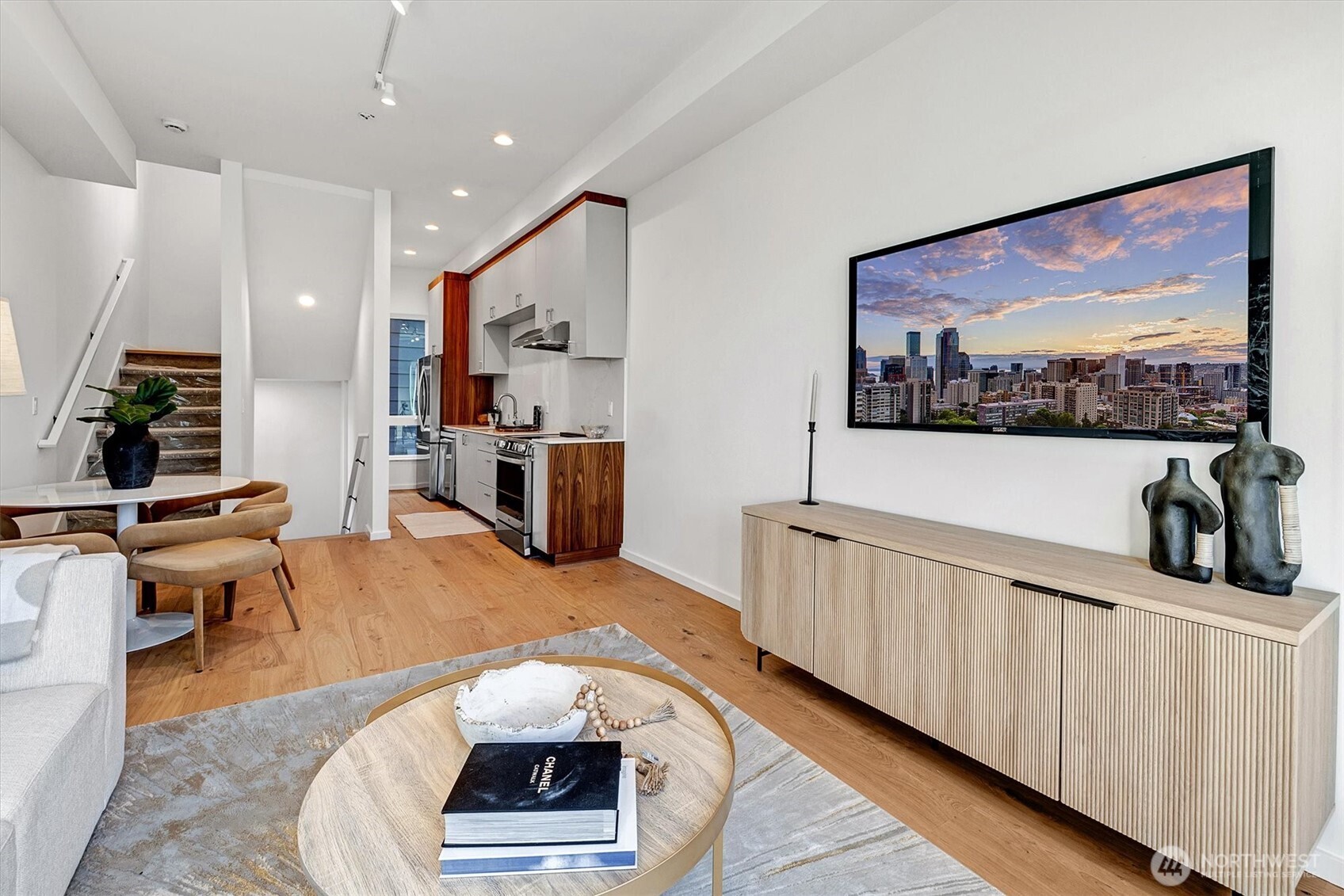 1227 East Roy Street Seattle, WA 98102 - Photo 10 of 35 a living room with furniture and a flat screen tv