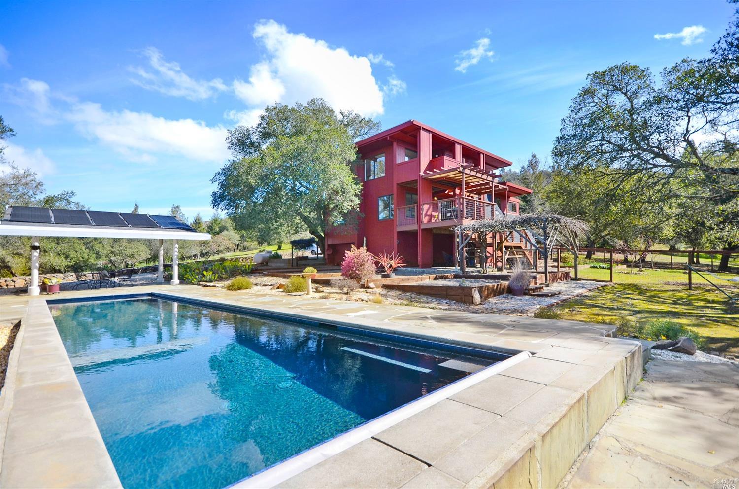a view of a swimming pool with a lounge chairs