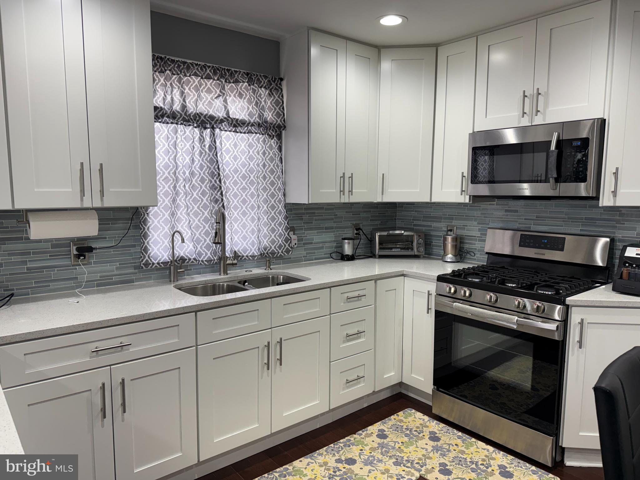 3499 Hillsmere Road Baltimore, MD 21207 - Photo 15 of 50 Modern kitchen with sleek cabinetry and style.