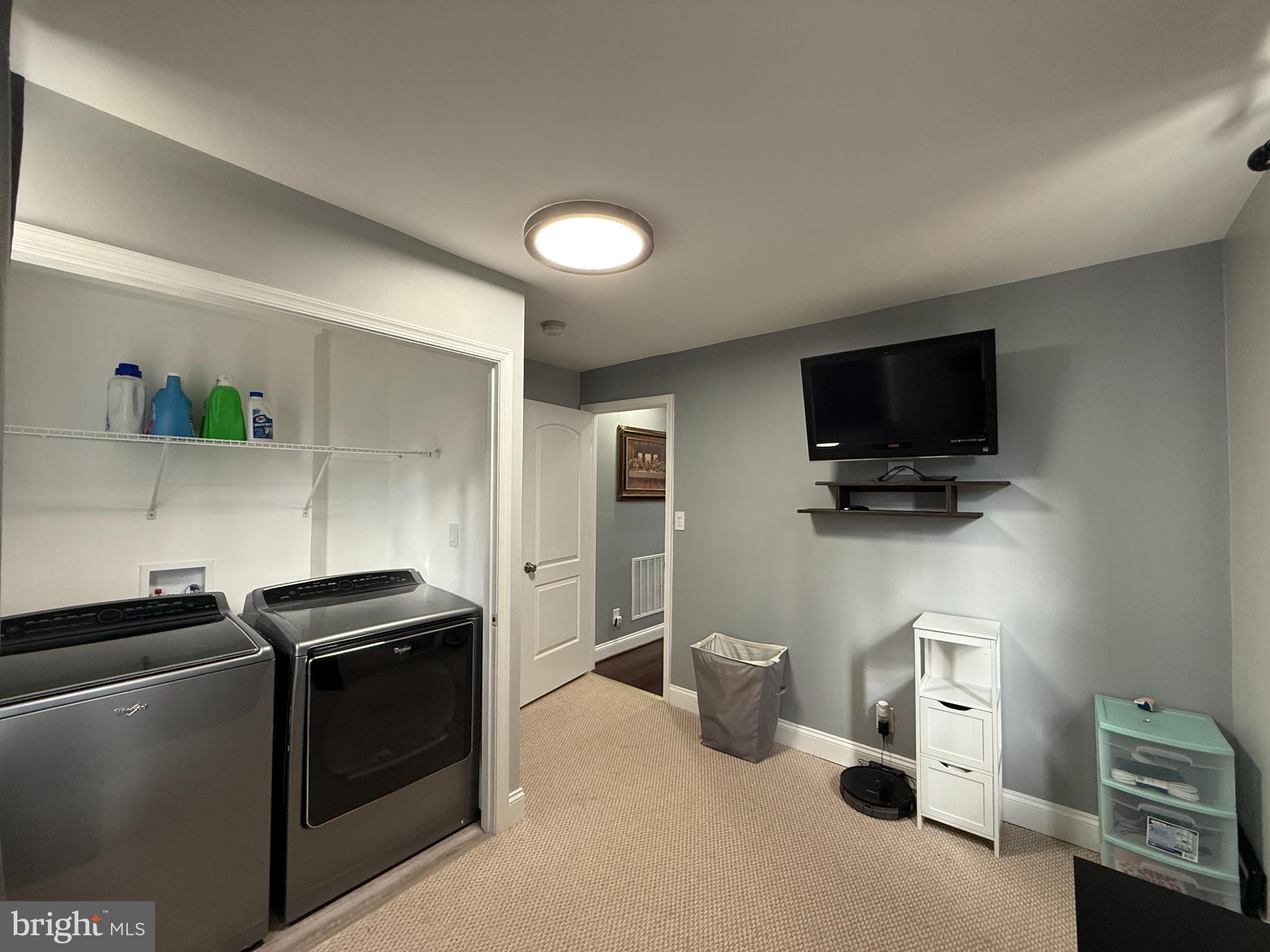 3499 Hillsmere Road Baltimore, MD 21207 - Photo 23 of 50 Modern laundry room with sleek appliances.
