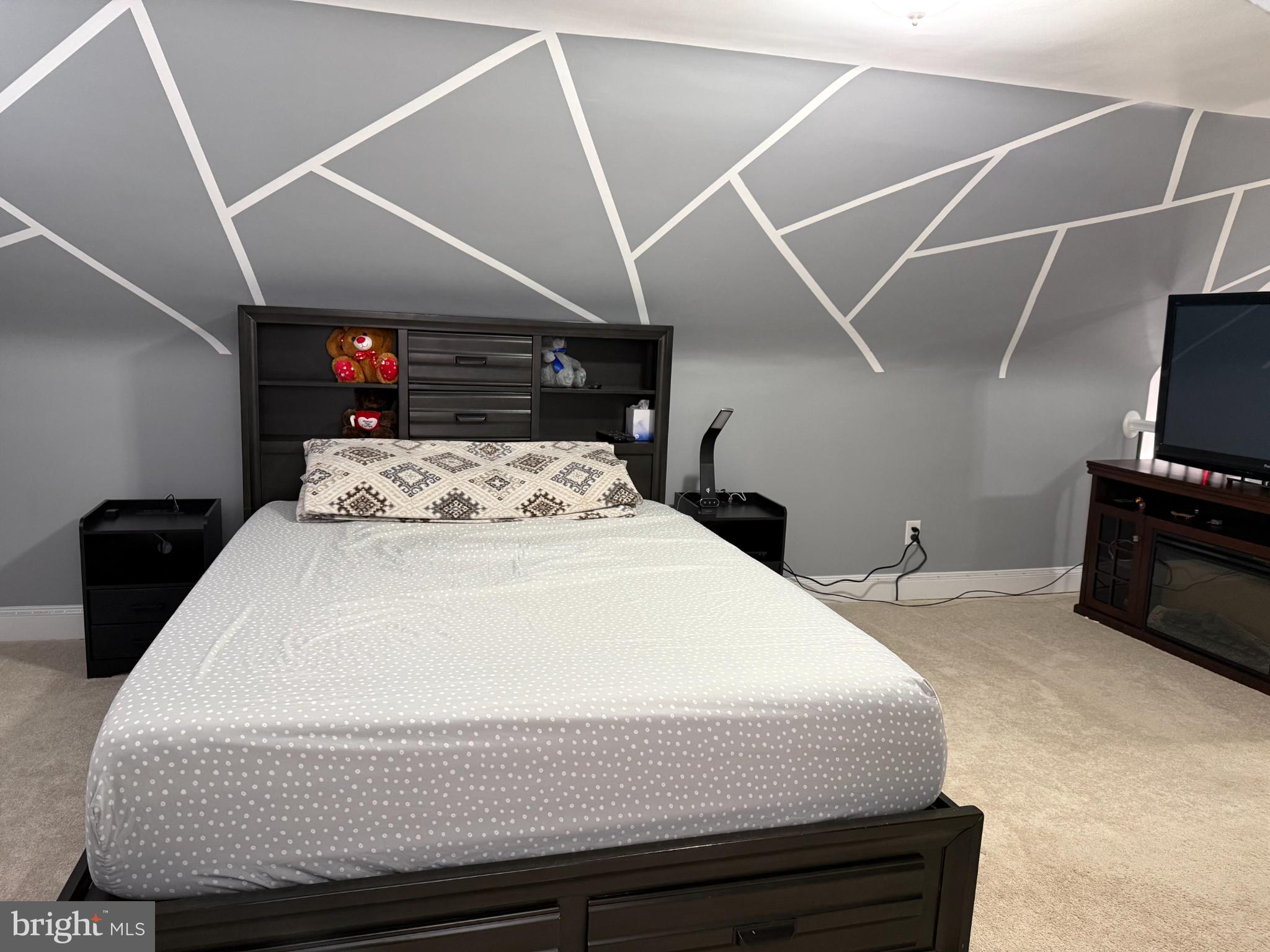 3499 Hillsmere Road Baltimore, MD 21207 - Photo 40 of 50 Modern bedroom with geometric accent wall.