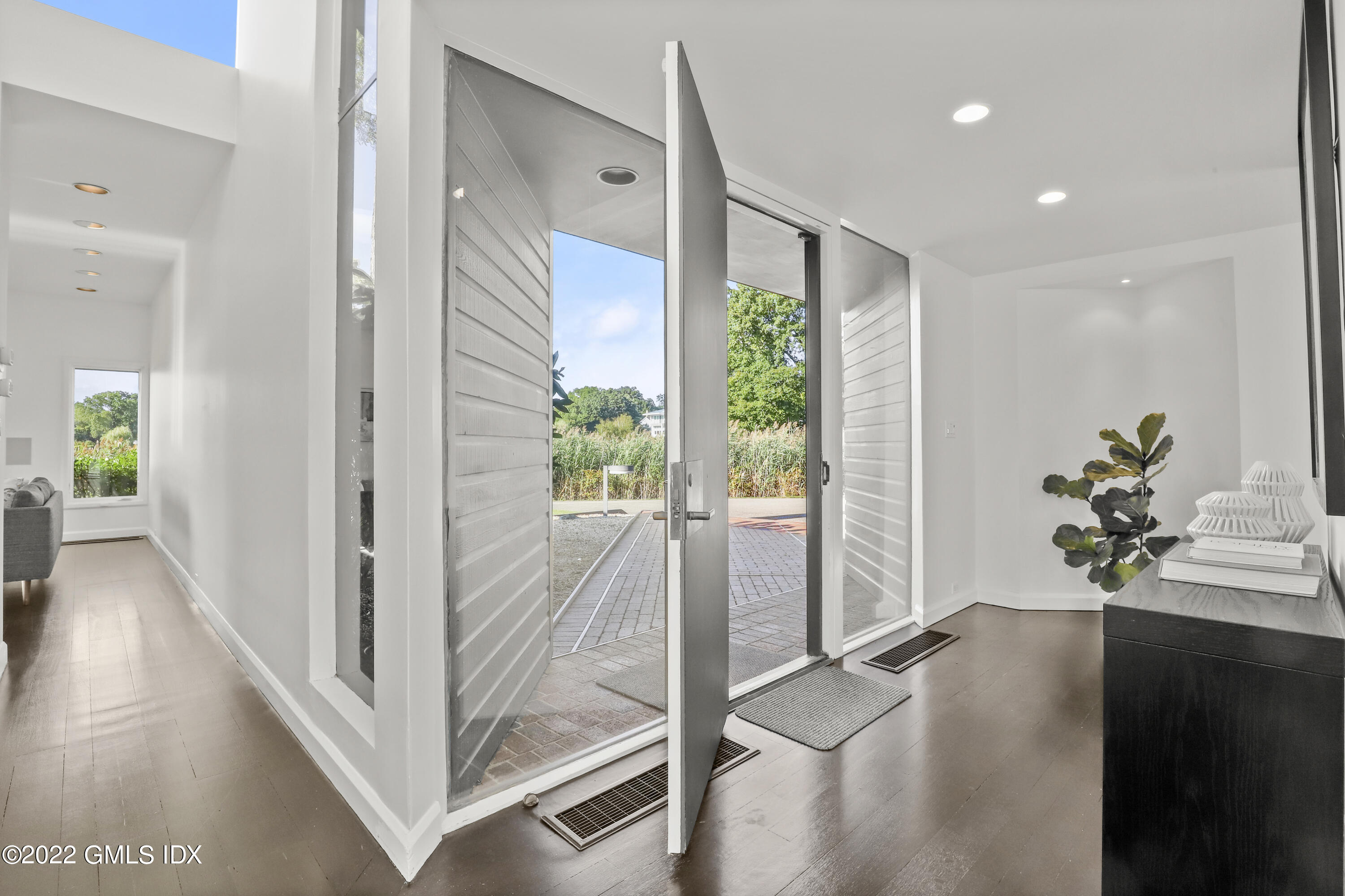 46 Carriglea Drive Riverside, CT 06878 - Photo 12 of 41 a view of an entryway with wooden floor and a glass door