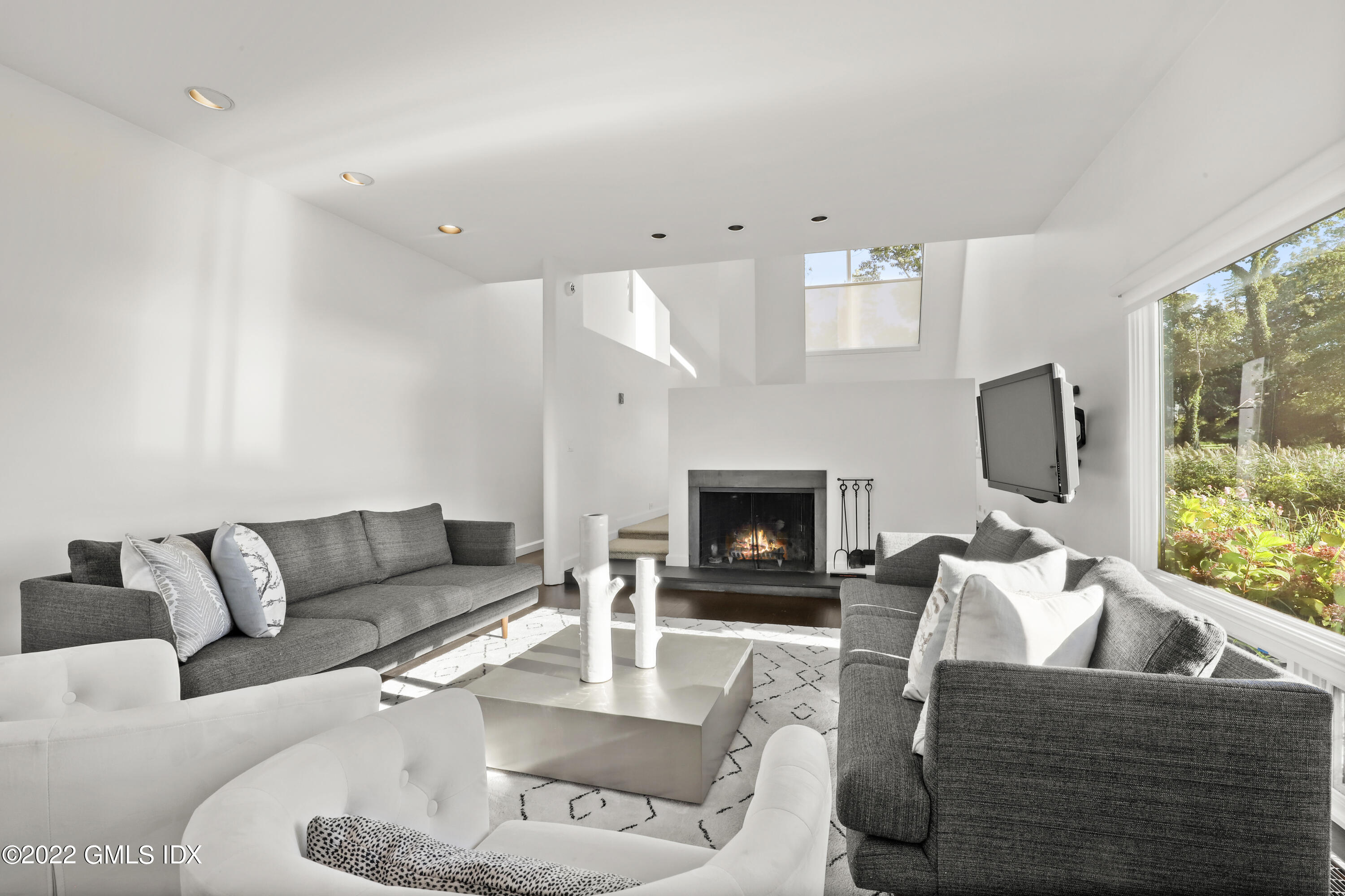 46 Carriglea Drive Riverside, CT 06878 - Photo 14 of 41 a living room with furniture fireplace and a flat screen tv
