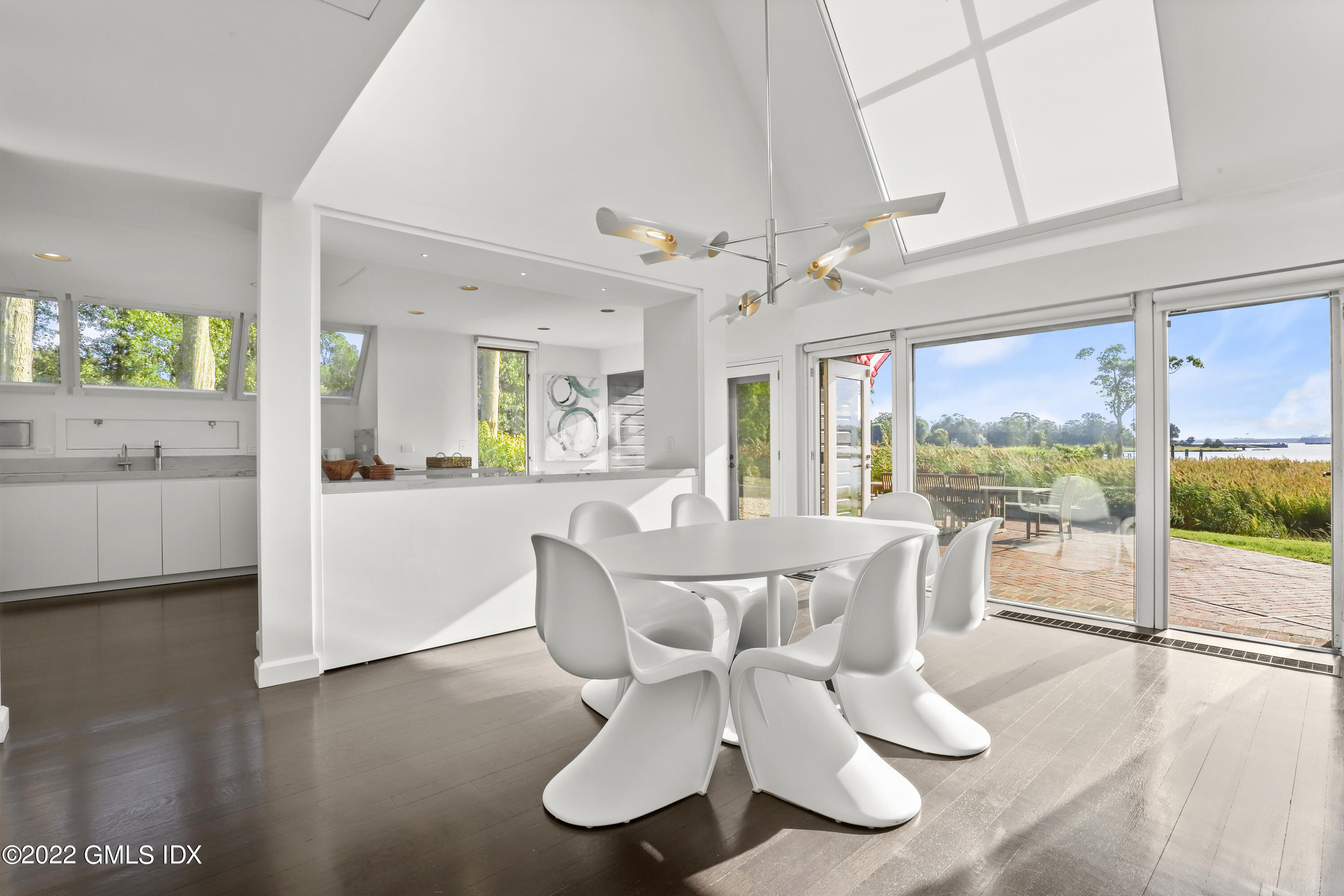 46 Carriglea Drive Riverside, CT 06878 - Photo 16 of 41 a view of a dining room with furniture wooden floor and chandelier