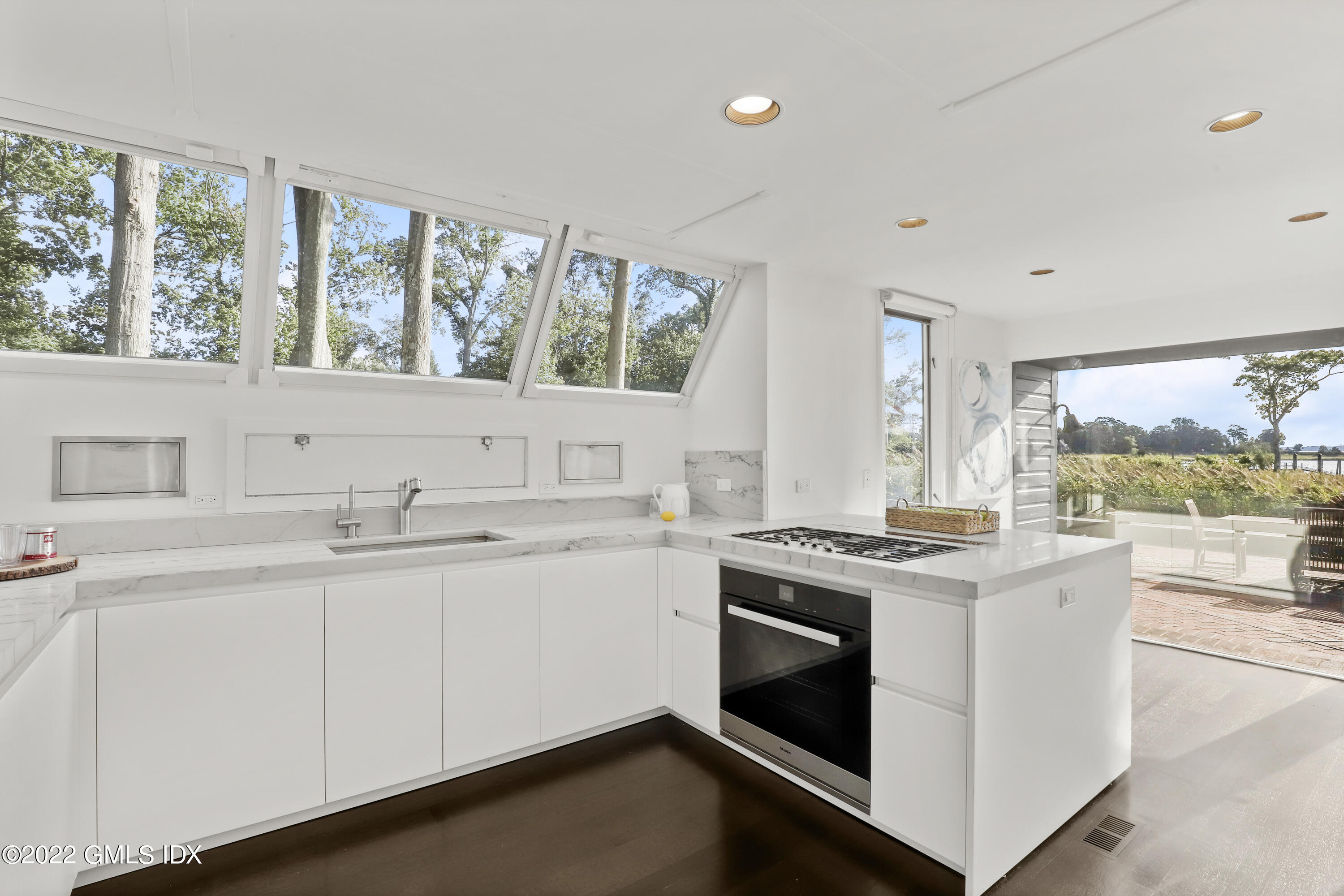 46 Carriglea Drive Riverside, CT 06878 - Photo 20 of 41 a kitchen with a stove and white cabinets