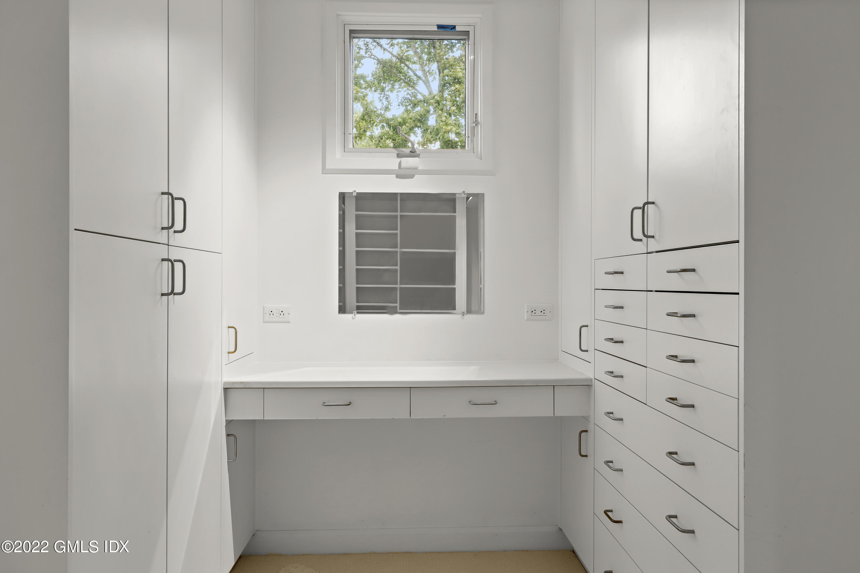 46 Carriglea Drive Riverside, CT 06878 - Photo 27 of 41 a room with cabinets and a window