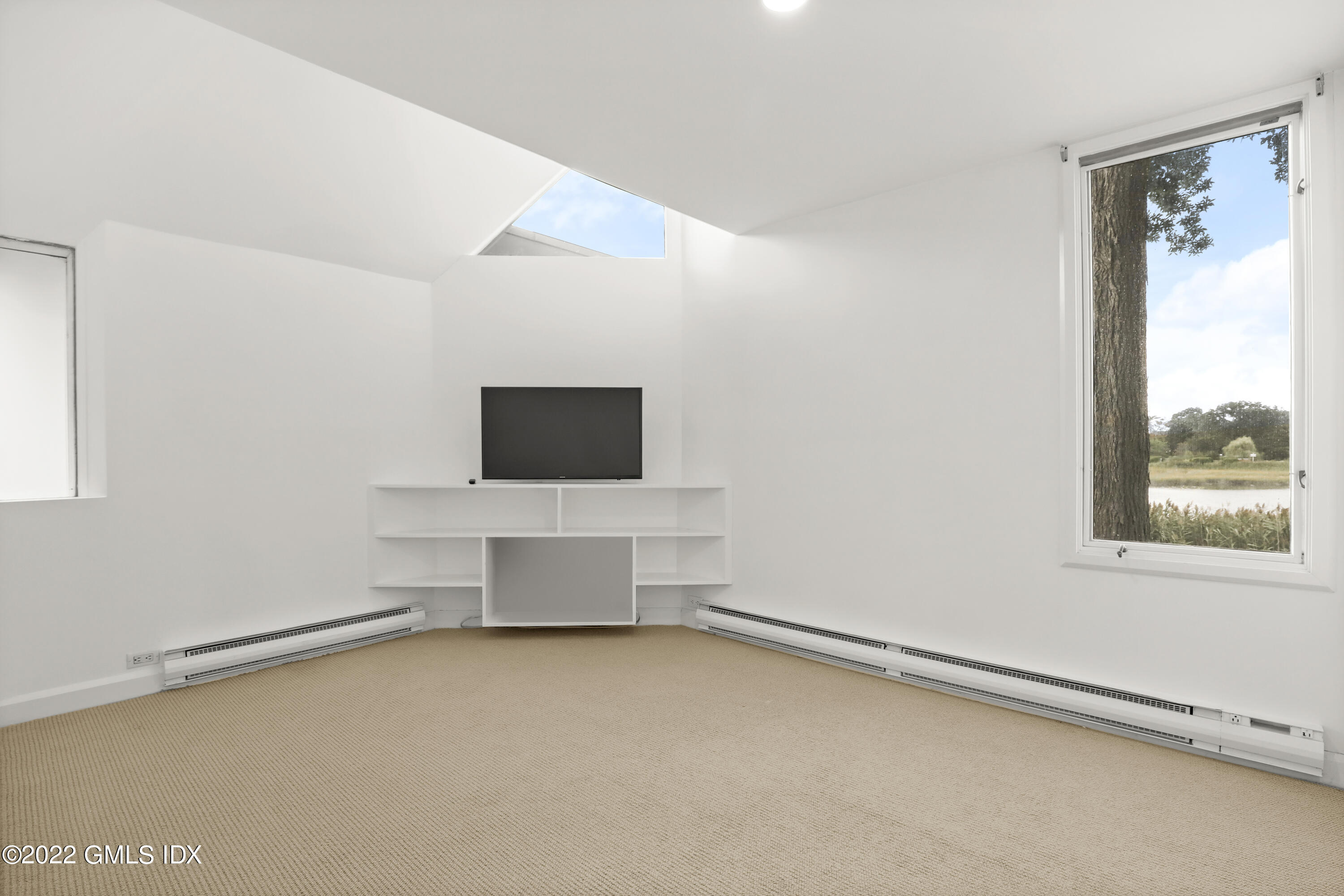 46 Carriglea Drive Riverside, CT 06878 - Photo 33 of 41 a living room with a flat screen tv