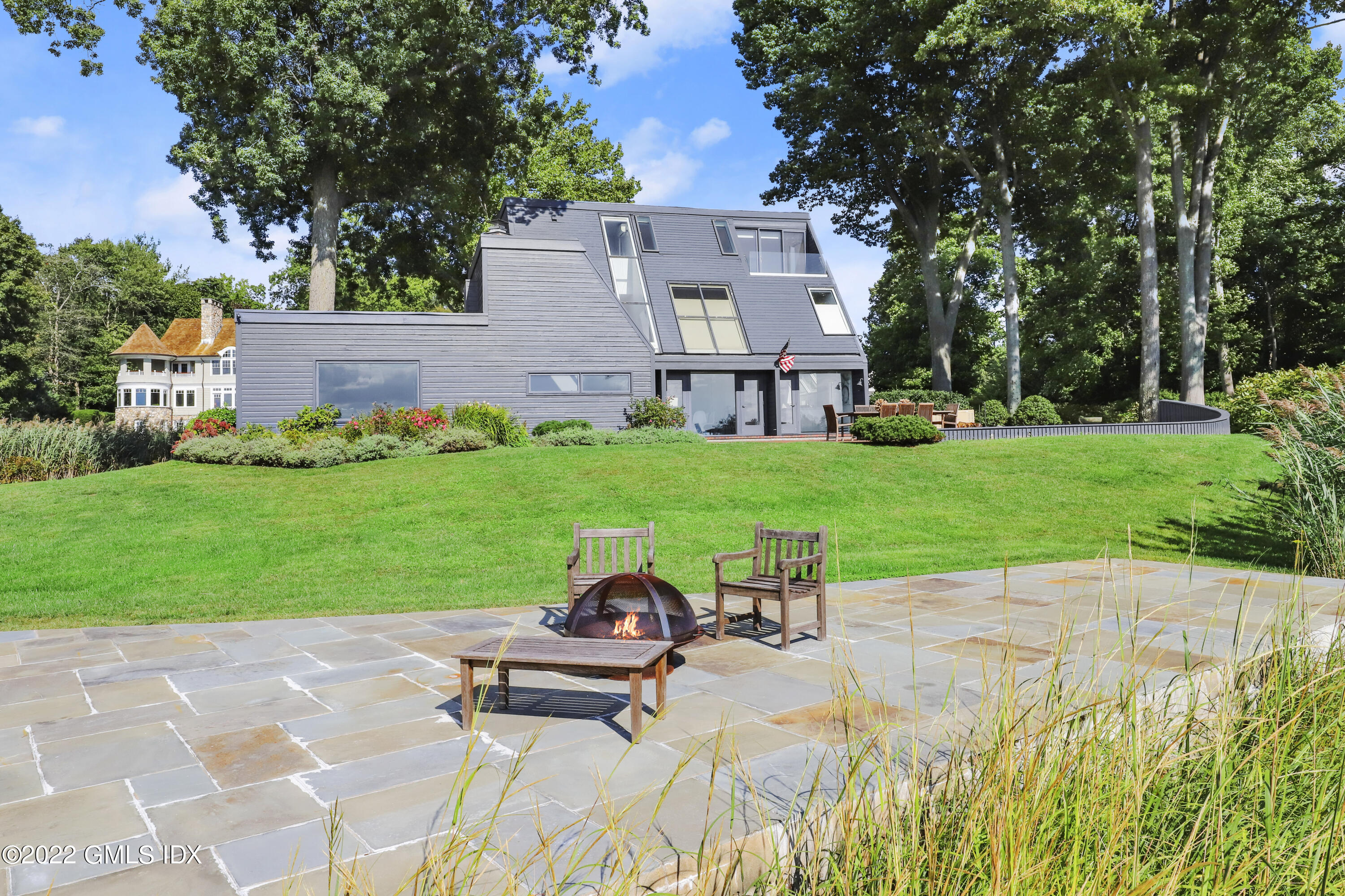 46 Carriglea Drive Riverside, CT 06878 - Photo 8 of 41 a view of a house with backyard sitting area and garden