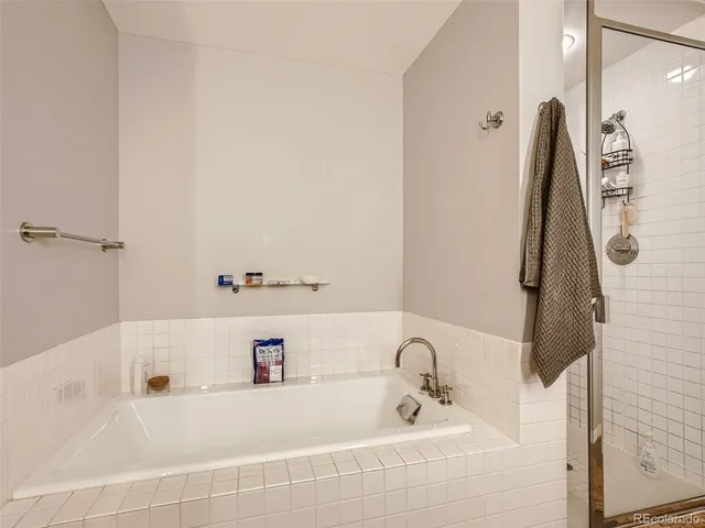 a bathroom with a tub and a sink
