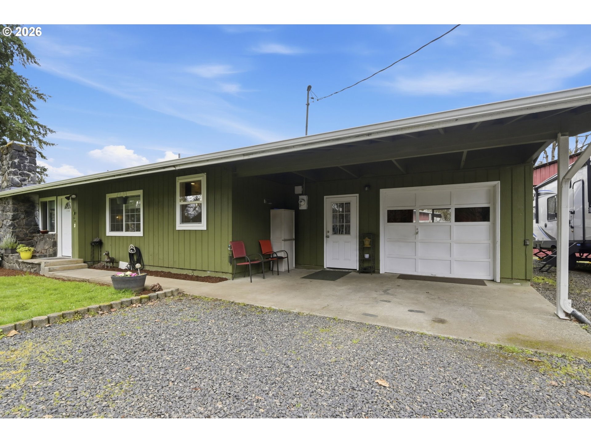 83840 Brown Road Dexter, OR 97431 - Photo 28 of 34 a front view of a house with a garden and porch