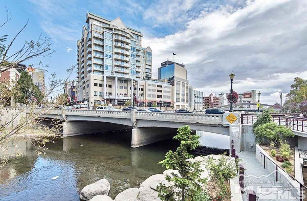 a view of balcony with outdoor seating and city view