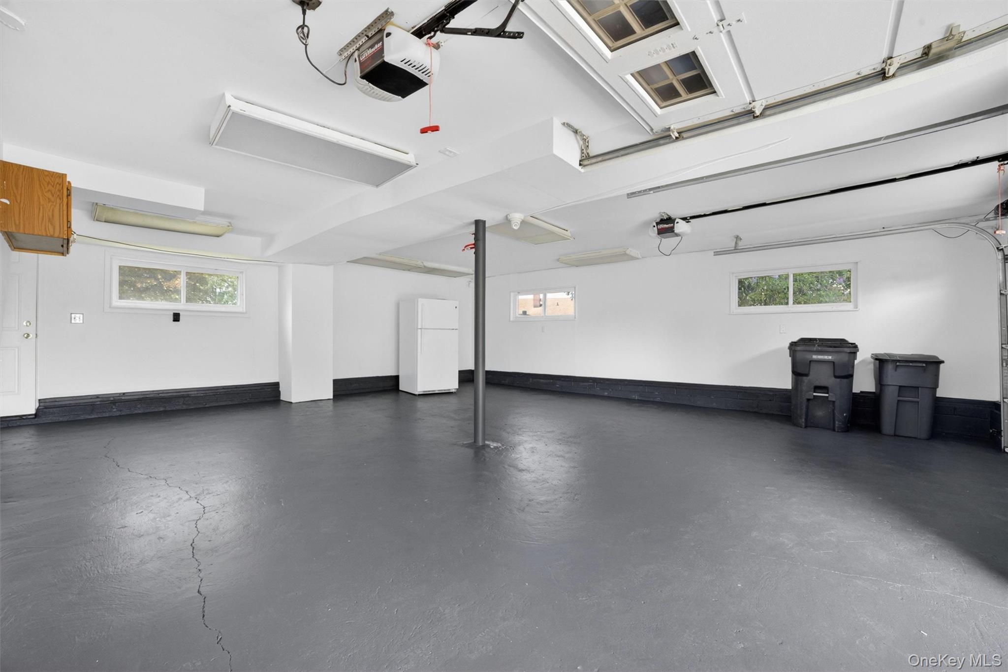 263 Croydon Road Yonkers, NY 10710 - Photo 35 of 43 an empty room with wooden floor and windows