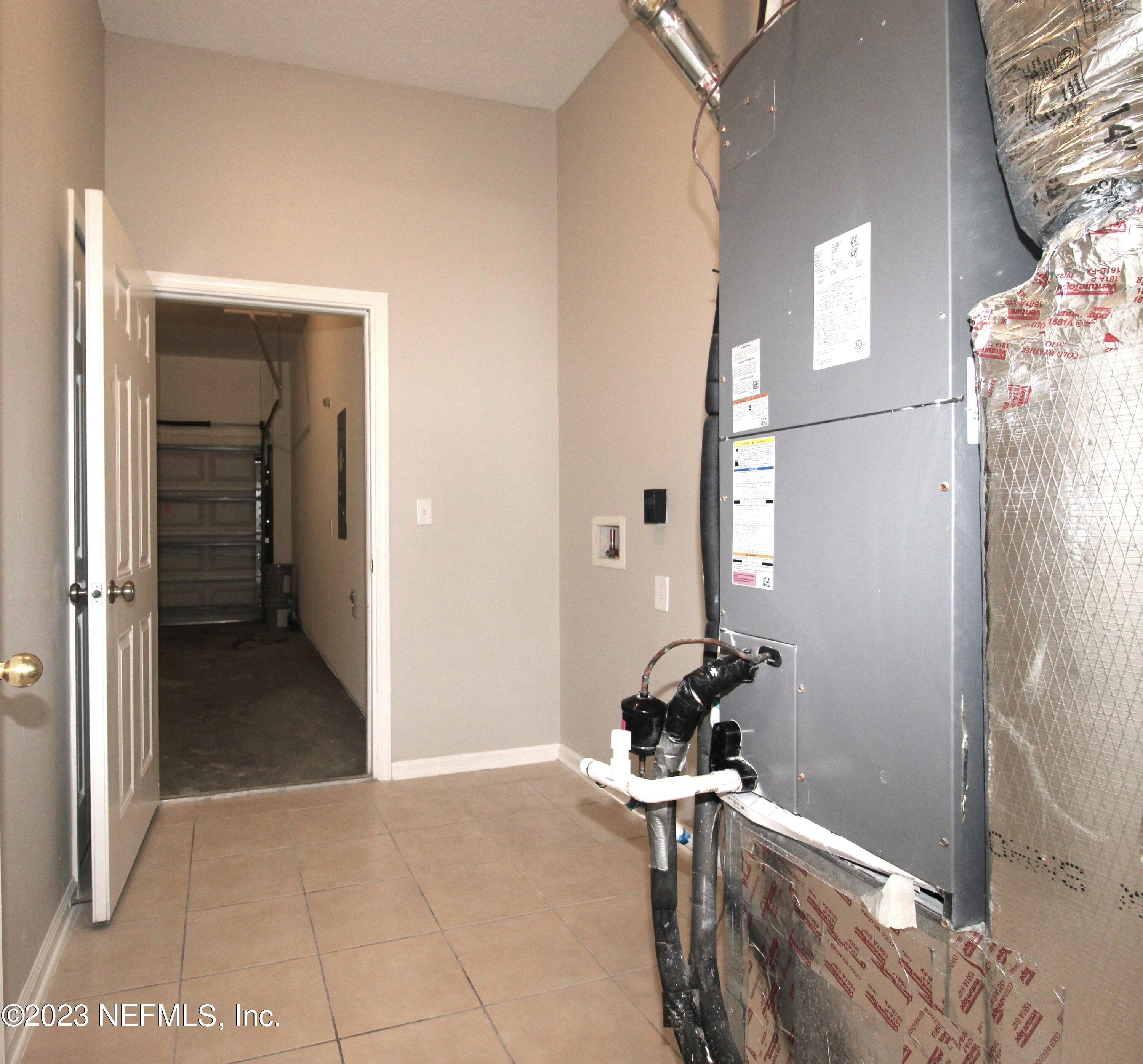 416 Golden Lake Loop St. Augustine, FL 32084 - Photo 16 of 22 a room that has a mirror and a wooden floor