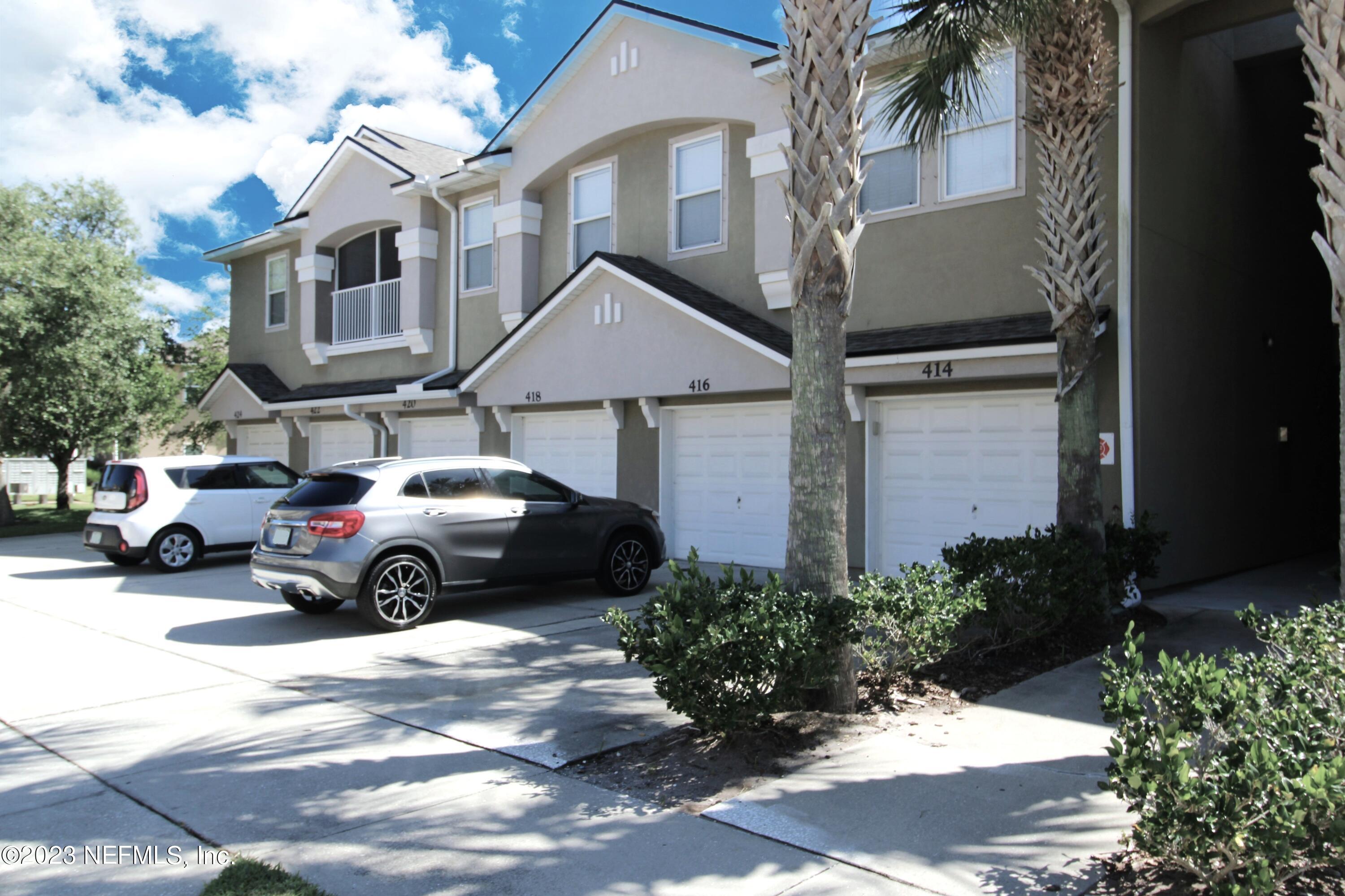 416 Golden Lake Loop St. Augustine, FL 32084 - Photo 19 of 22 a view of a car parked in front of a house