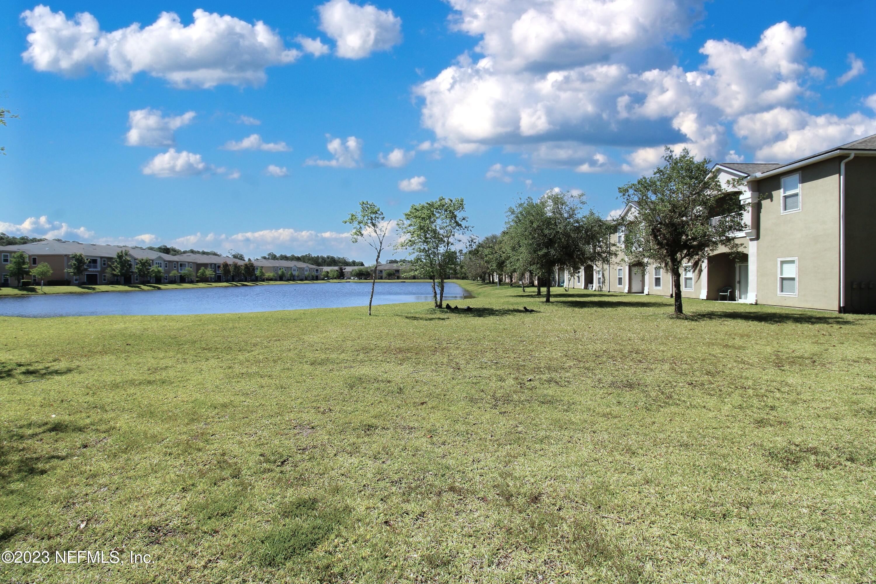 416 Golden Lake Loop St. Augustine, FL 32084 - Photo 21 of 22 a view of outdoor space with green field and trees