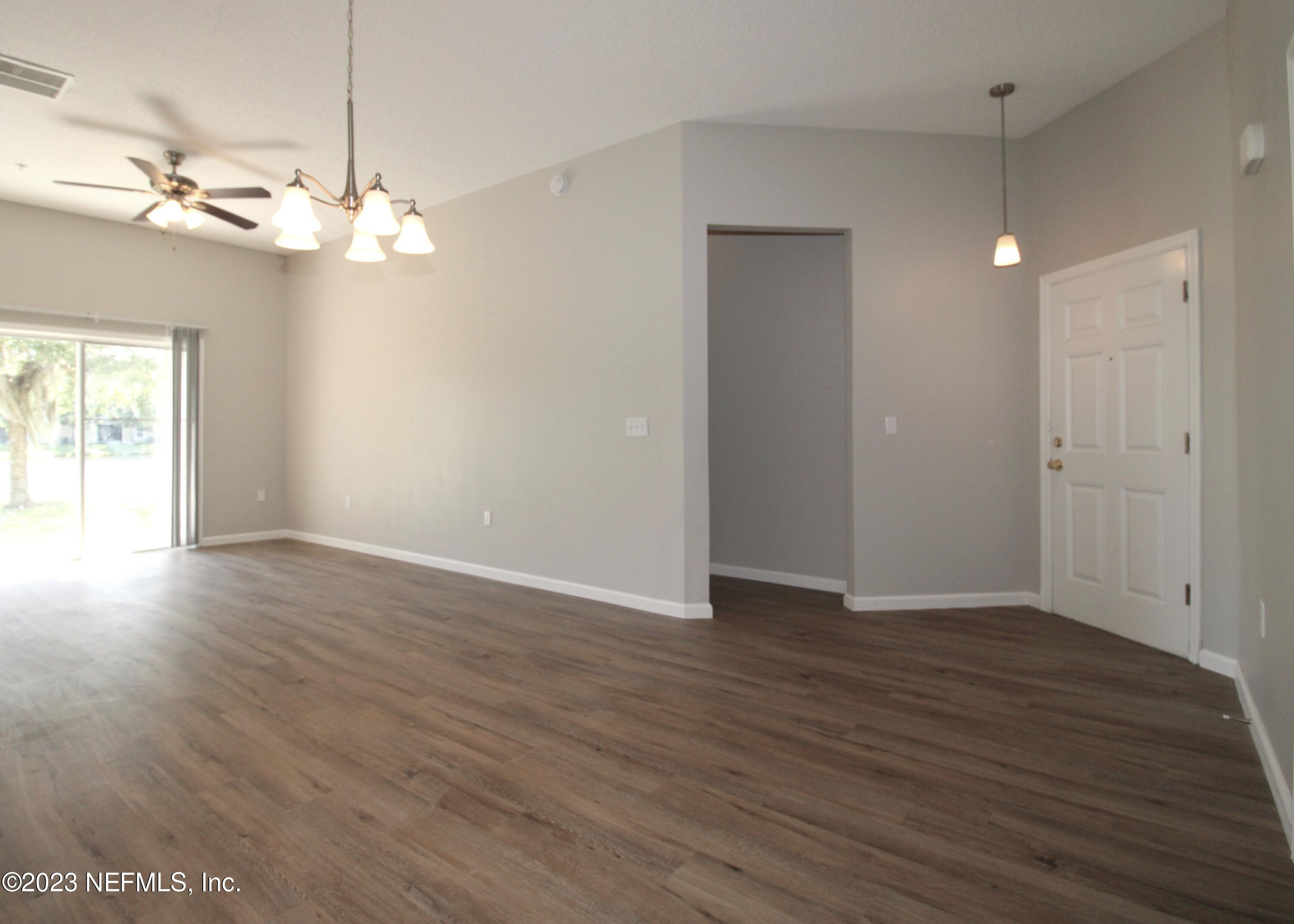 416 Golden Lake Loop St. Augustine, FL 32084 - Photo 4 of 22 a view of a room with wooden floor and window