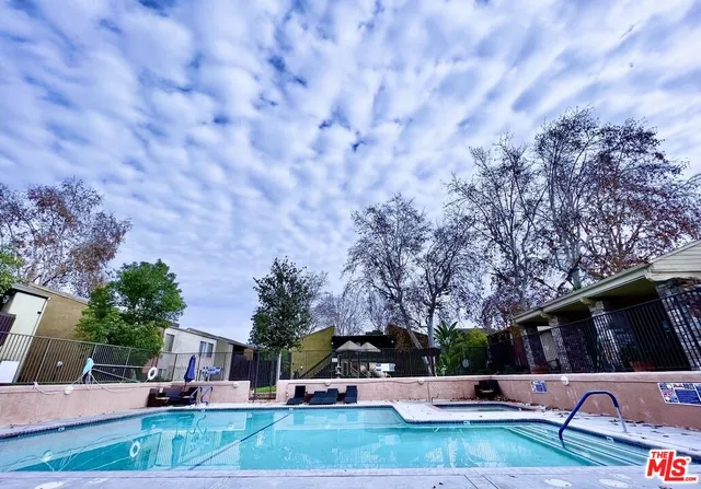 a view of patio with swimming pool