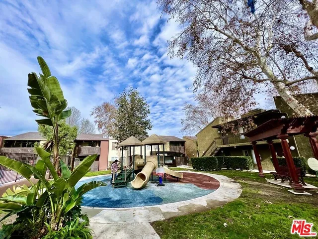an aerial view of a swimming pool with outdoor space