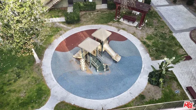 a view of a house with wooden fence
