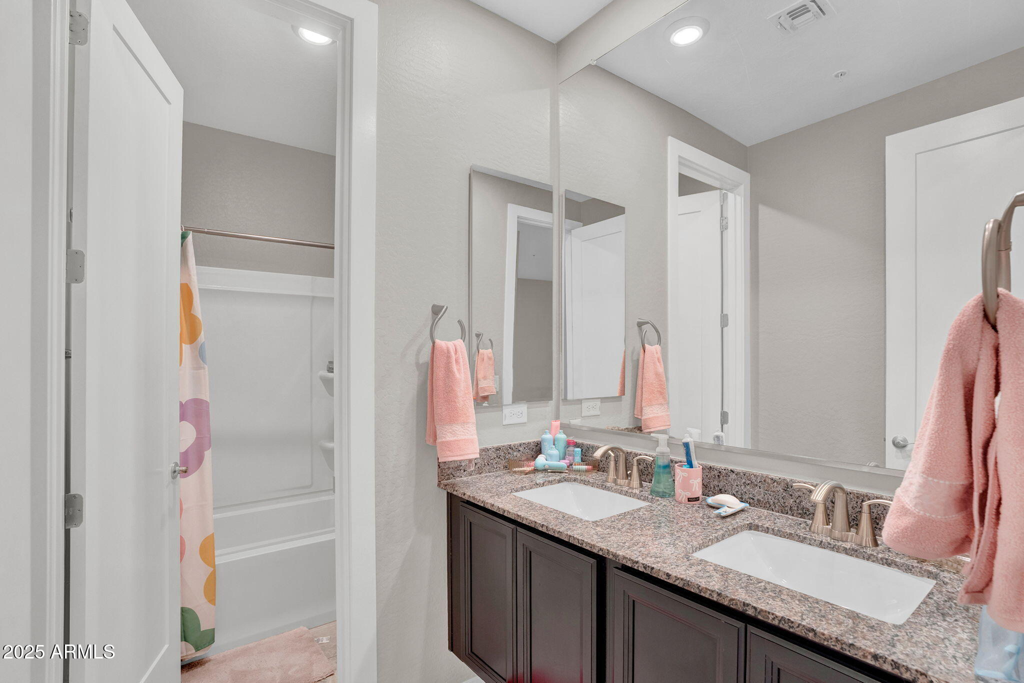 3855 South McQueen Road, Unit 73 Chandler, AZ 85286 - Photo 18 of 24 a bathroom with a granite countertop sink and a mirror