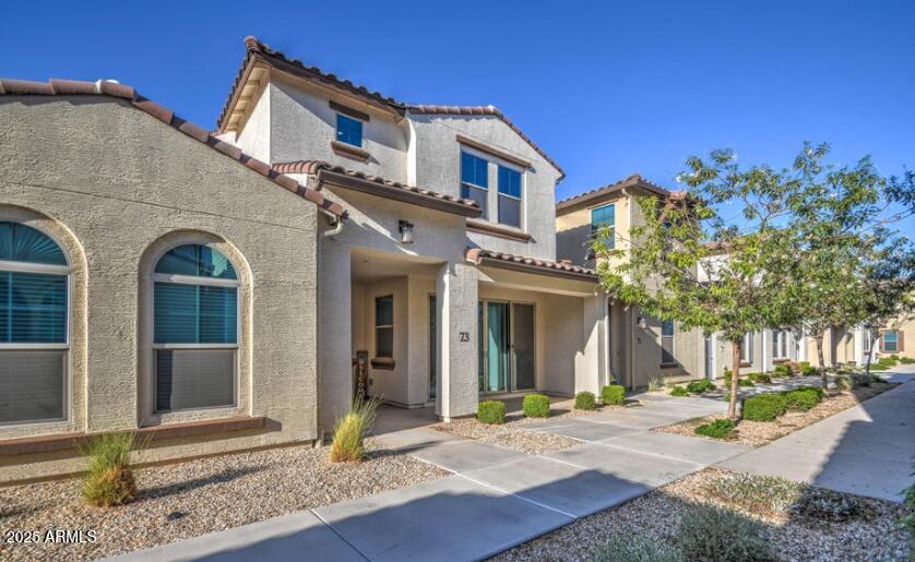 3855 South McQueen Road, Unit 73 Chandler, AZ 85286 - Photo 24 of 24 a front view of a house with garden