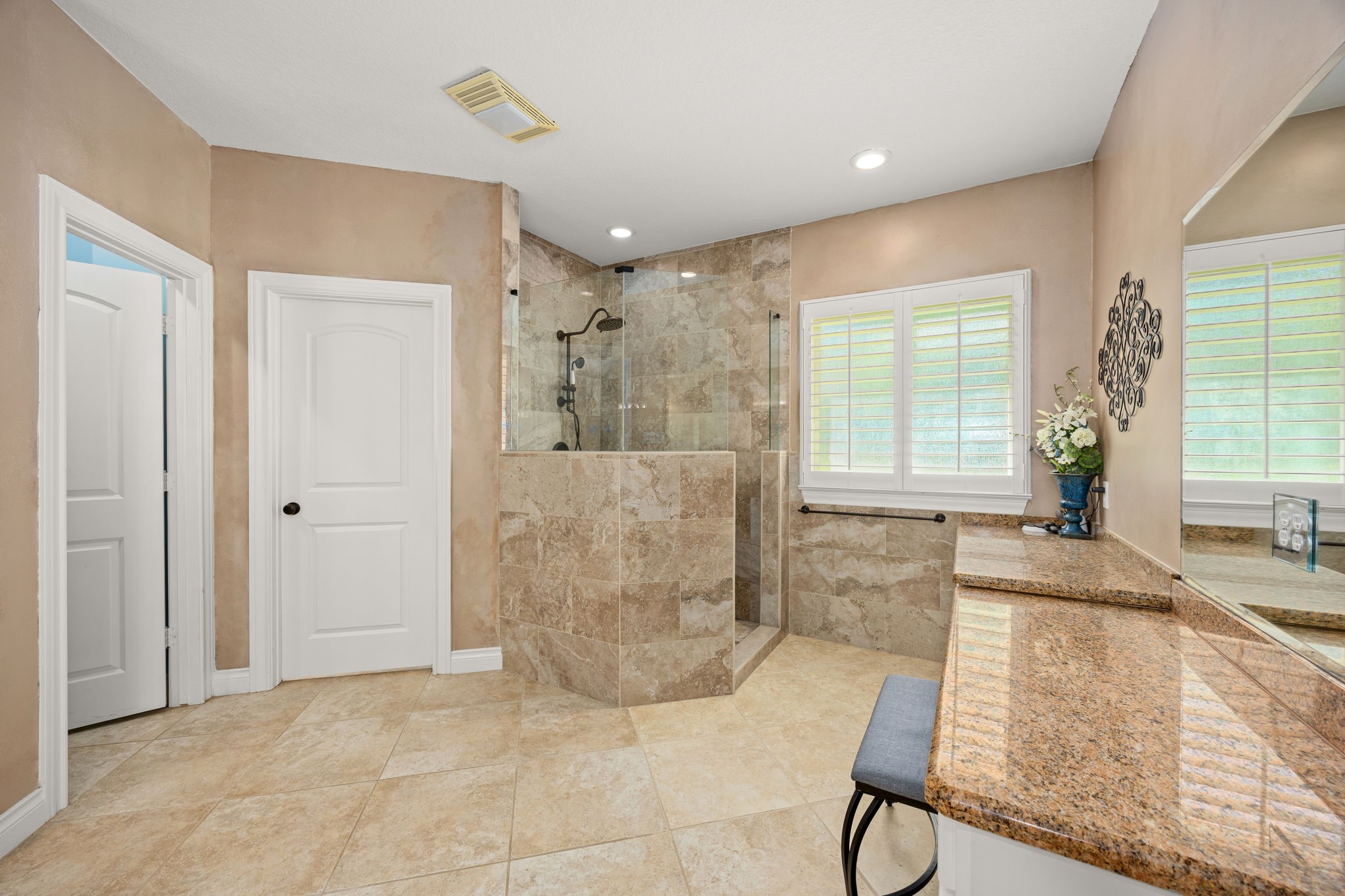 13506 Stagecoach Road Magnolia, TX 77355 - Photo 16 of 37 a spacious bathroom with a granite countertop bathtub sink and mirror