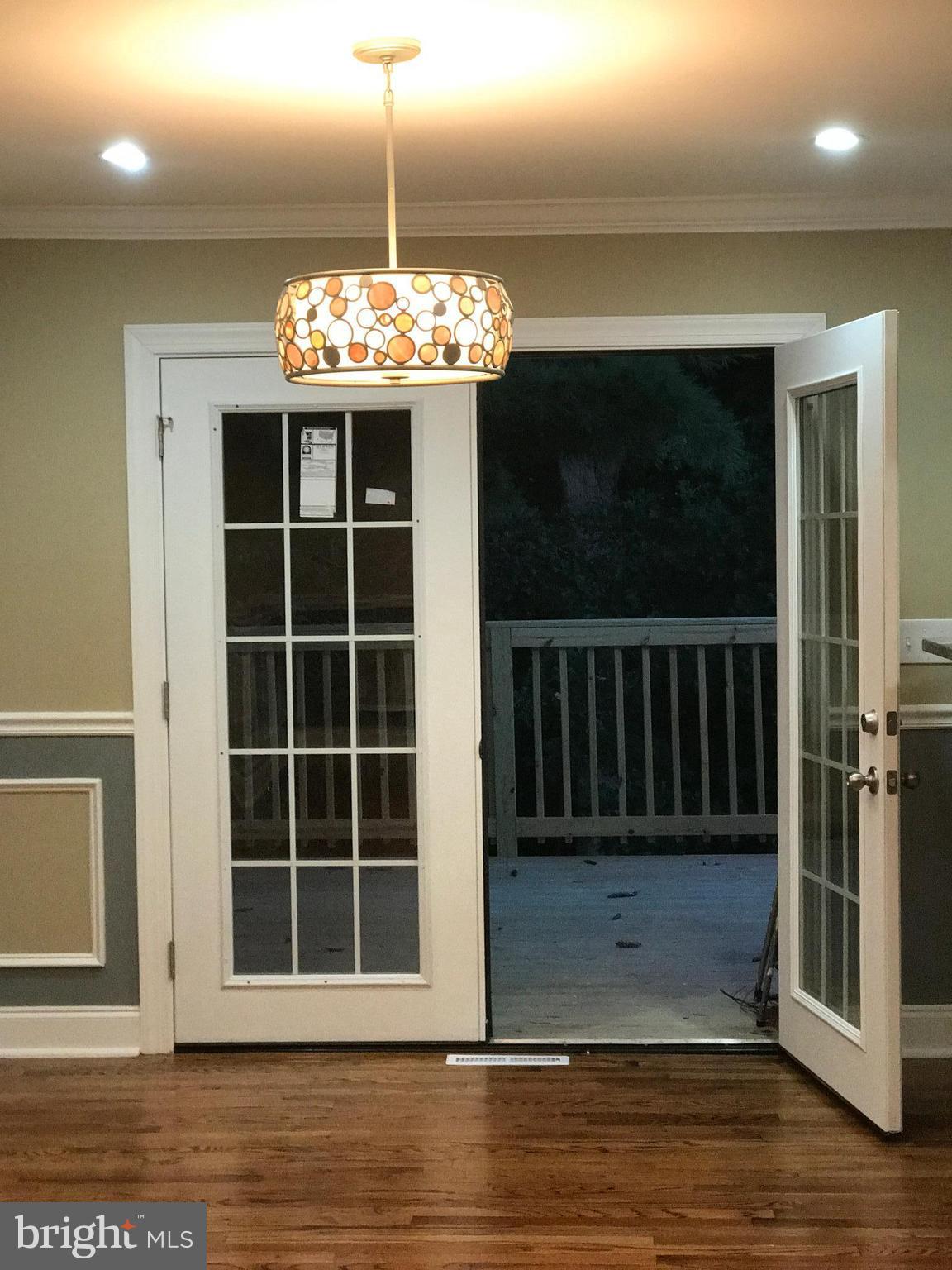 6710 Fox Meadow Road Baltimore, MD 21207 - Photo 2 of 24 a view of a livingroom with a chandelier