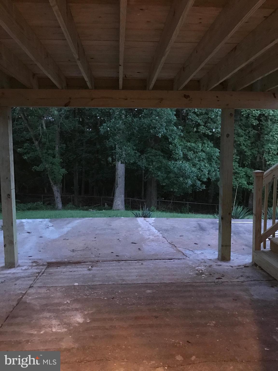 6710 Fox Meadow Road Baltimore, MD 21207 - Photo 13 of 24 a patio with a wooden fence