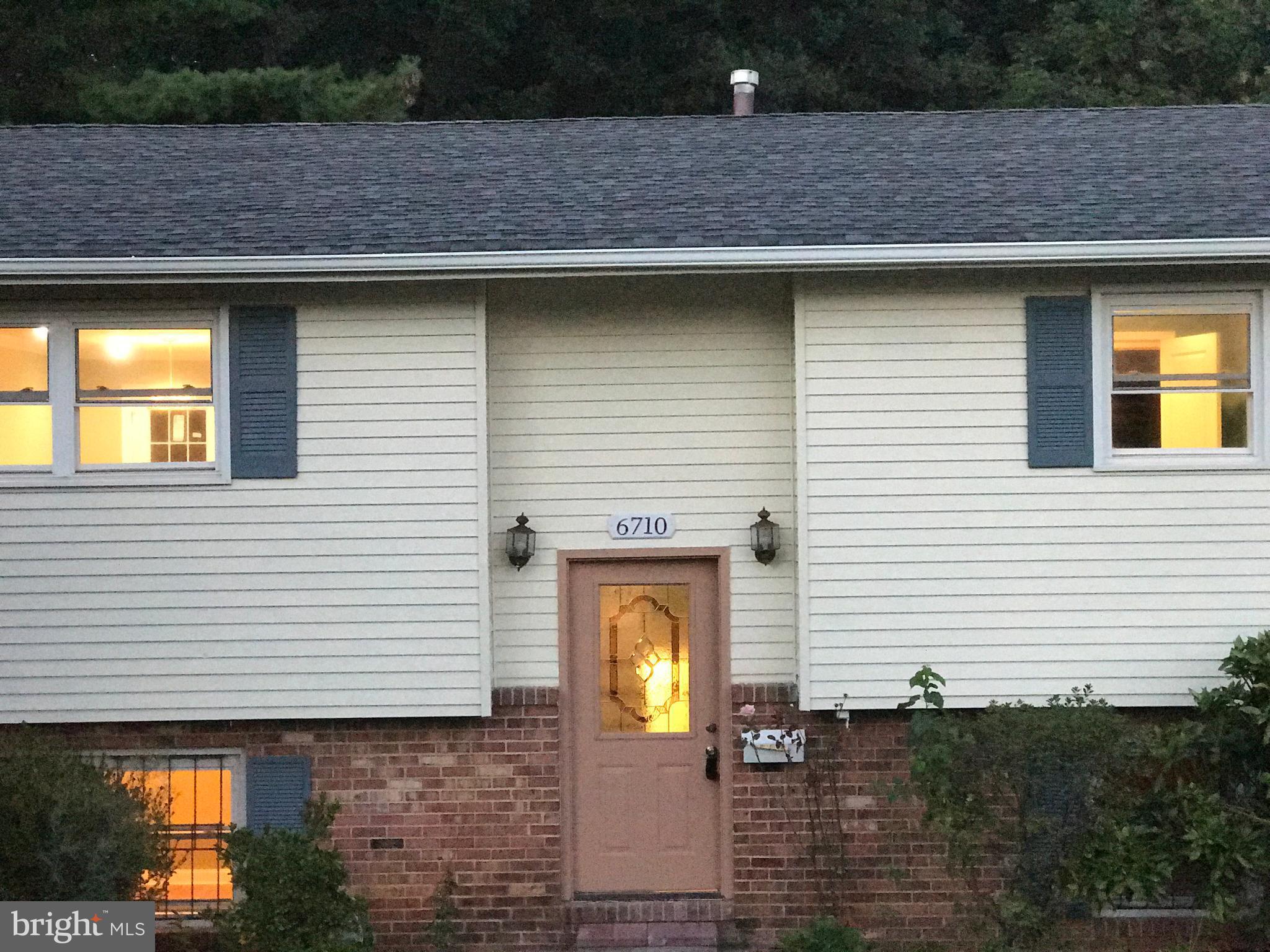 6710 Fox Meadow Road Baltimore, MD 21207 - Photo 20 of 24 a front view of a house with yard