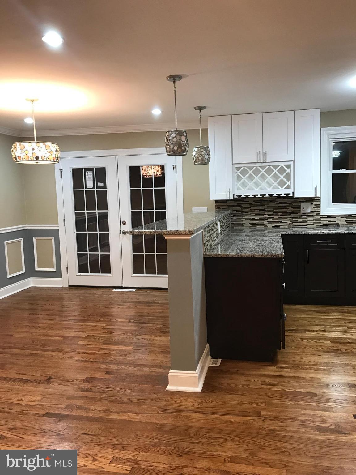 6710 Fox Meadow Road Baltimore, MD 21207 - Photo 22 of 24 a kitchen with stainless steel appliances granite countertop a stove and a sink