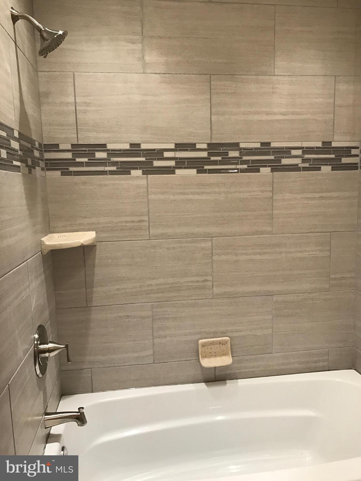 6710 Fox Meadow Road Baltimore, MD 21207 - Photo 6 of 24 a bathroom with a shower