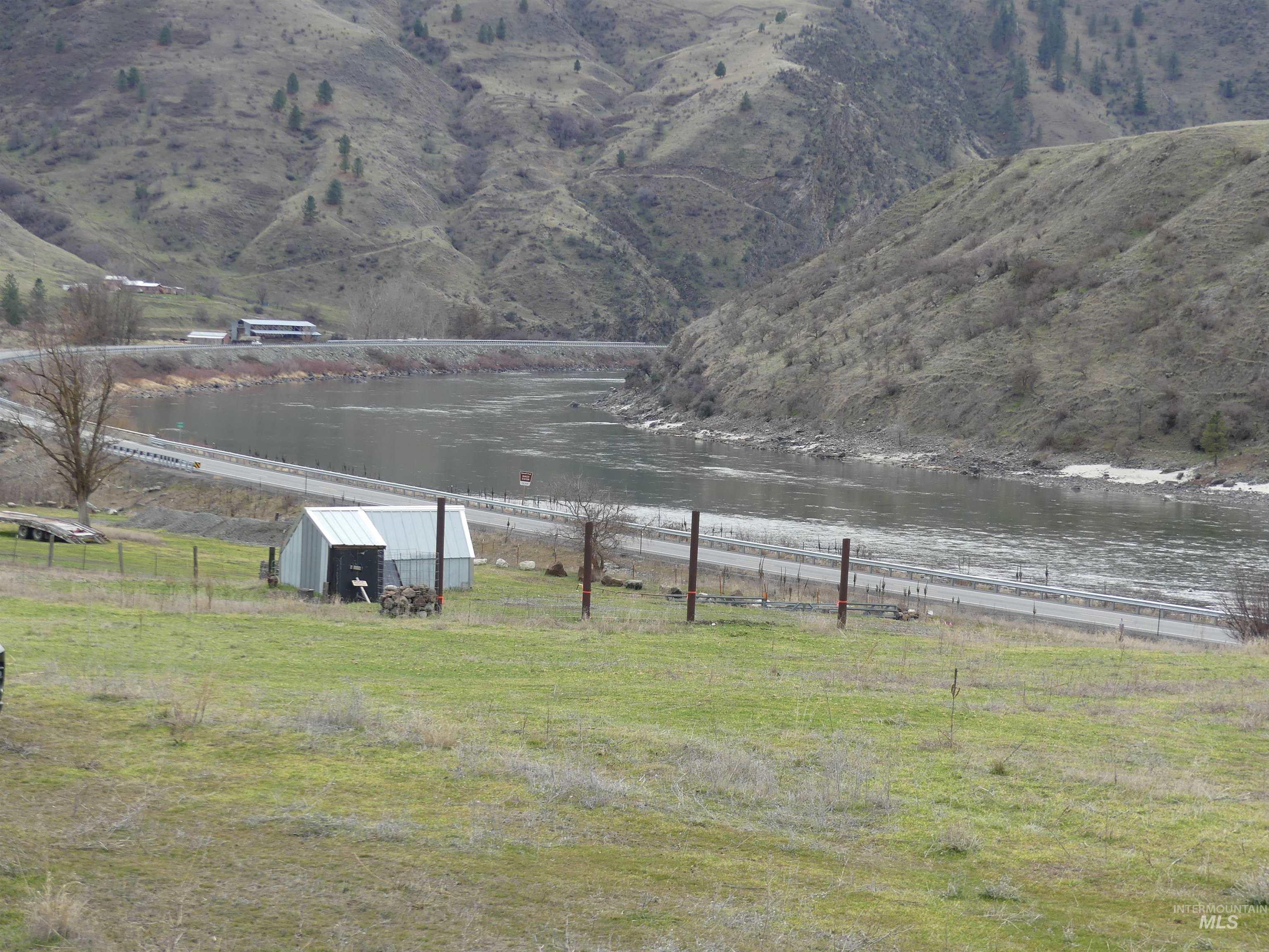 260 Slate Creek Road White Bird, ID 83554 - Photo 12 of 50 View of yard featuring a water view and an outdoor structure