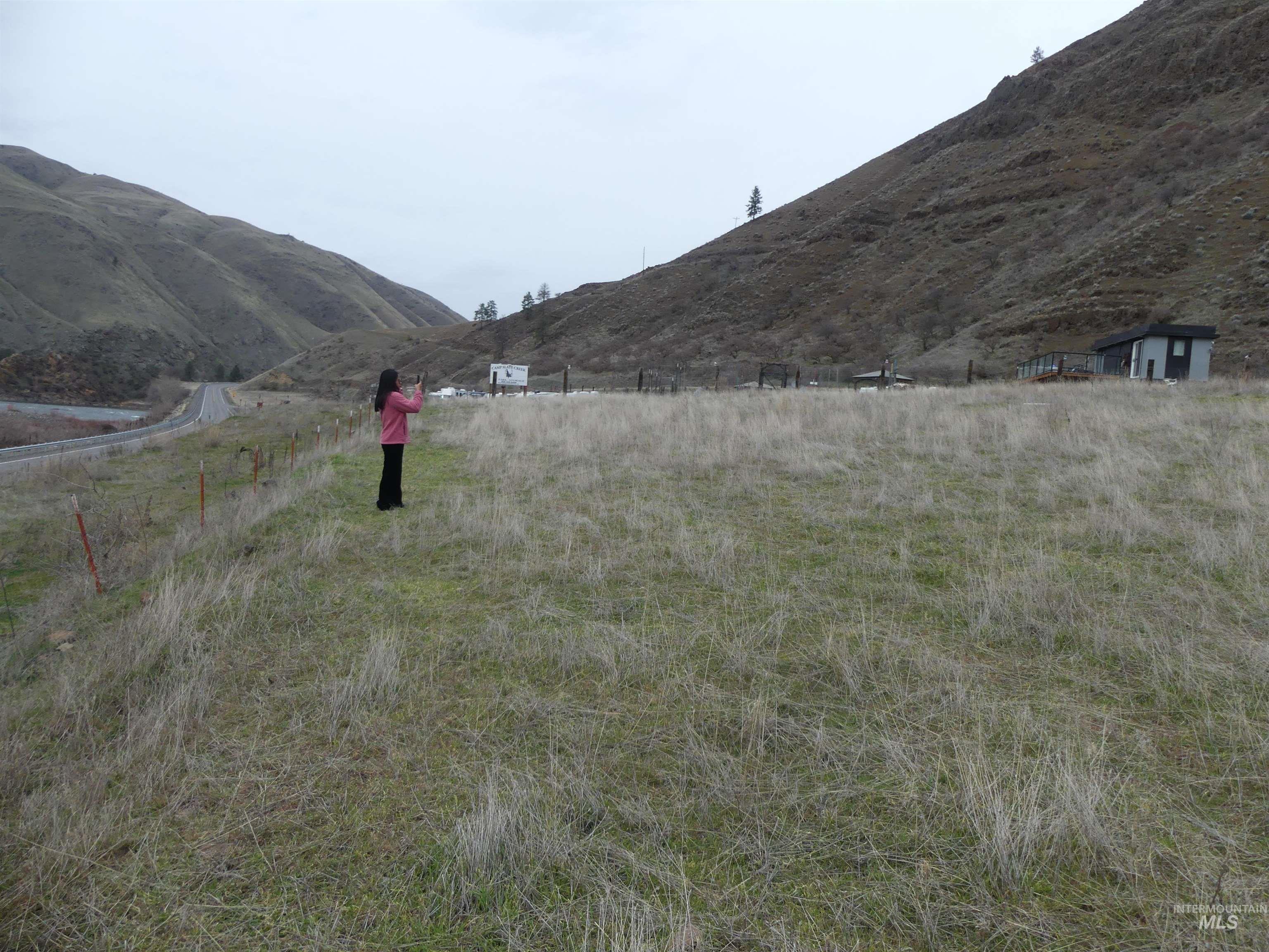 260 Slate Creek Road White Bird, ID 83554 - Photo 30 of 50 View of yard featuring a mountain view and a rural view