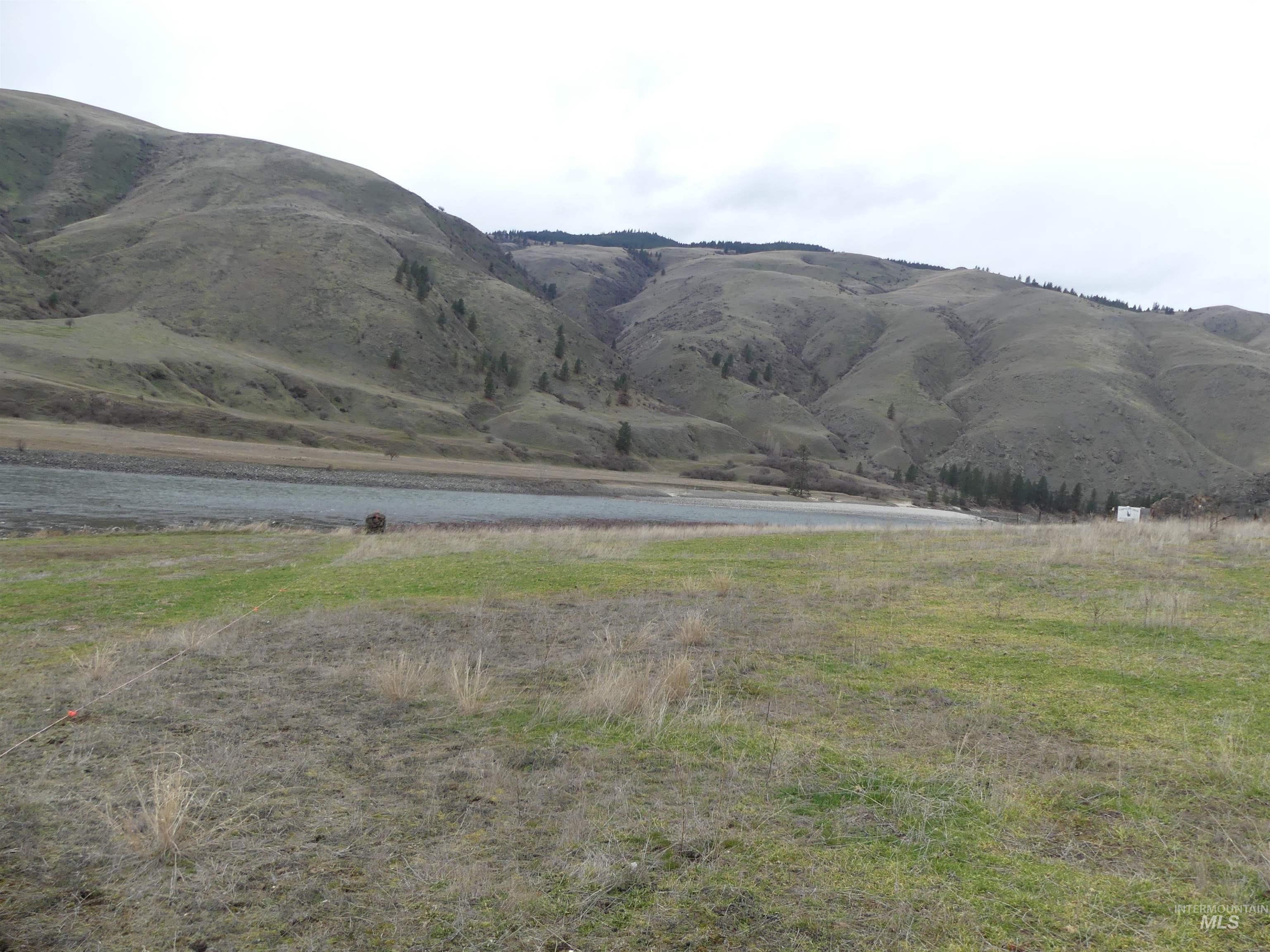 260 Slate Creek Road White Bird, ID 83554 - Photo 37 of 50 View of mountain background with a nearby body of water