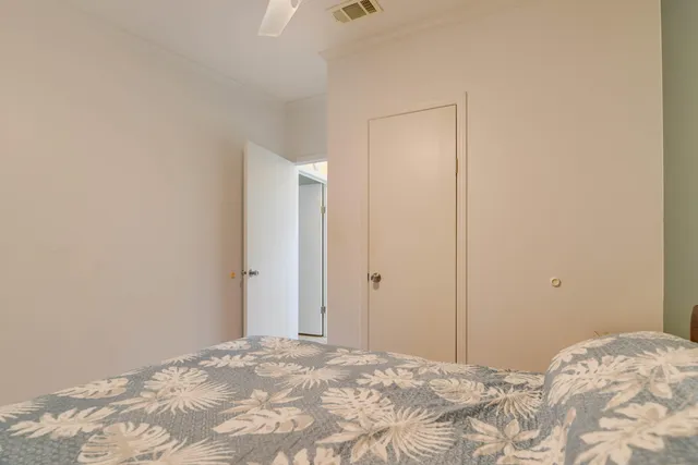 a bedroom with a bed and a mirror