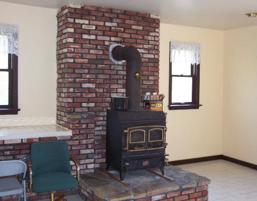 122 Mankey Road Washington, PA 15301 - Photo 3 of 8 Living Room. Wood stove to provide additional heat source
