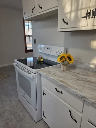 a bathroom with a sink toilet and a mirror