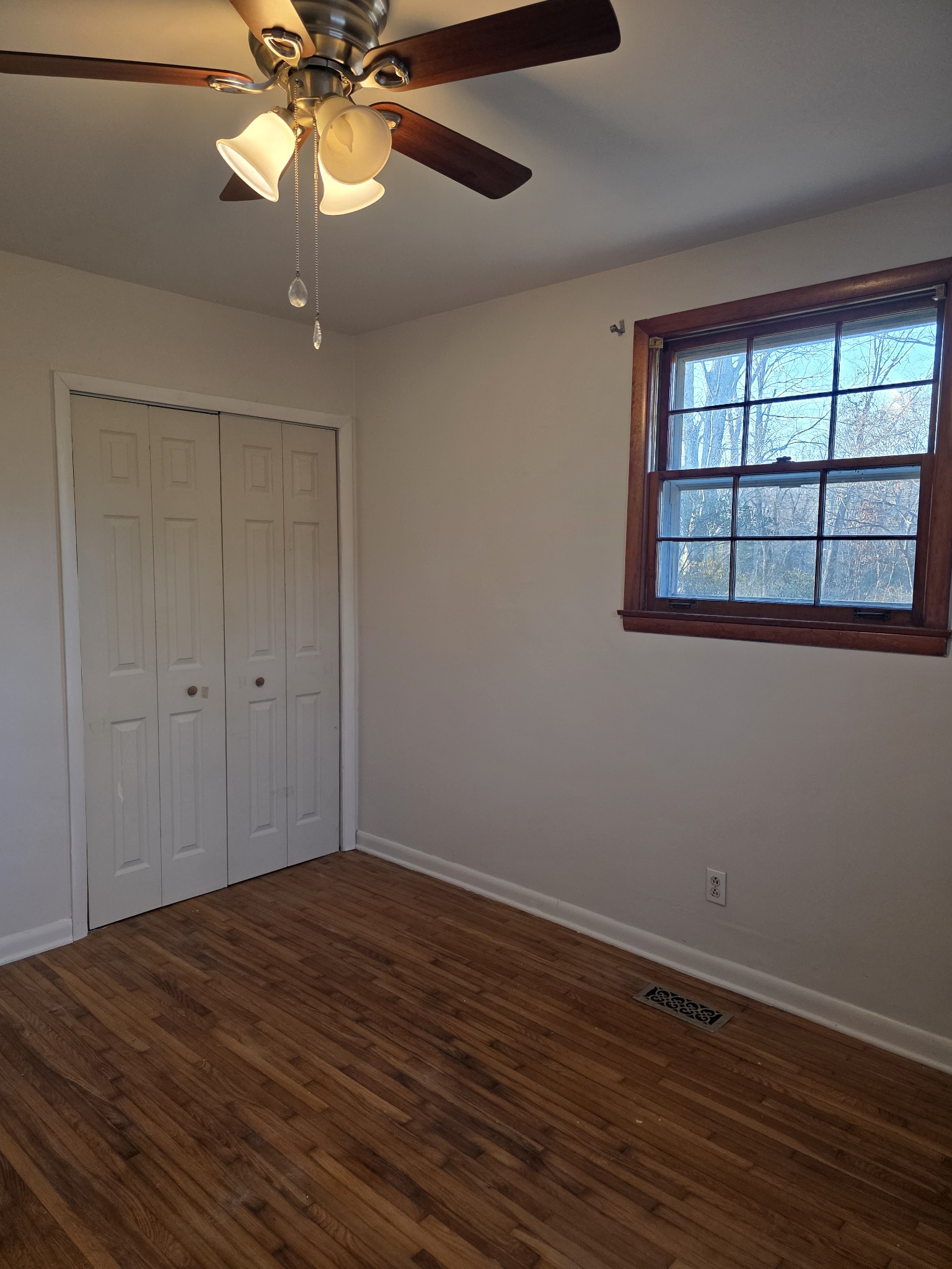 1497 Mt Pleasant Road Kingston Springs, TN 37082 - Photo 20 of 25 a view of empty room with wooden floor and fan