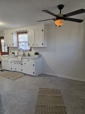 a kitchen with stainless steel appliances granite countertop a stove a refrigerator and a sink