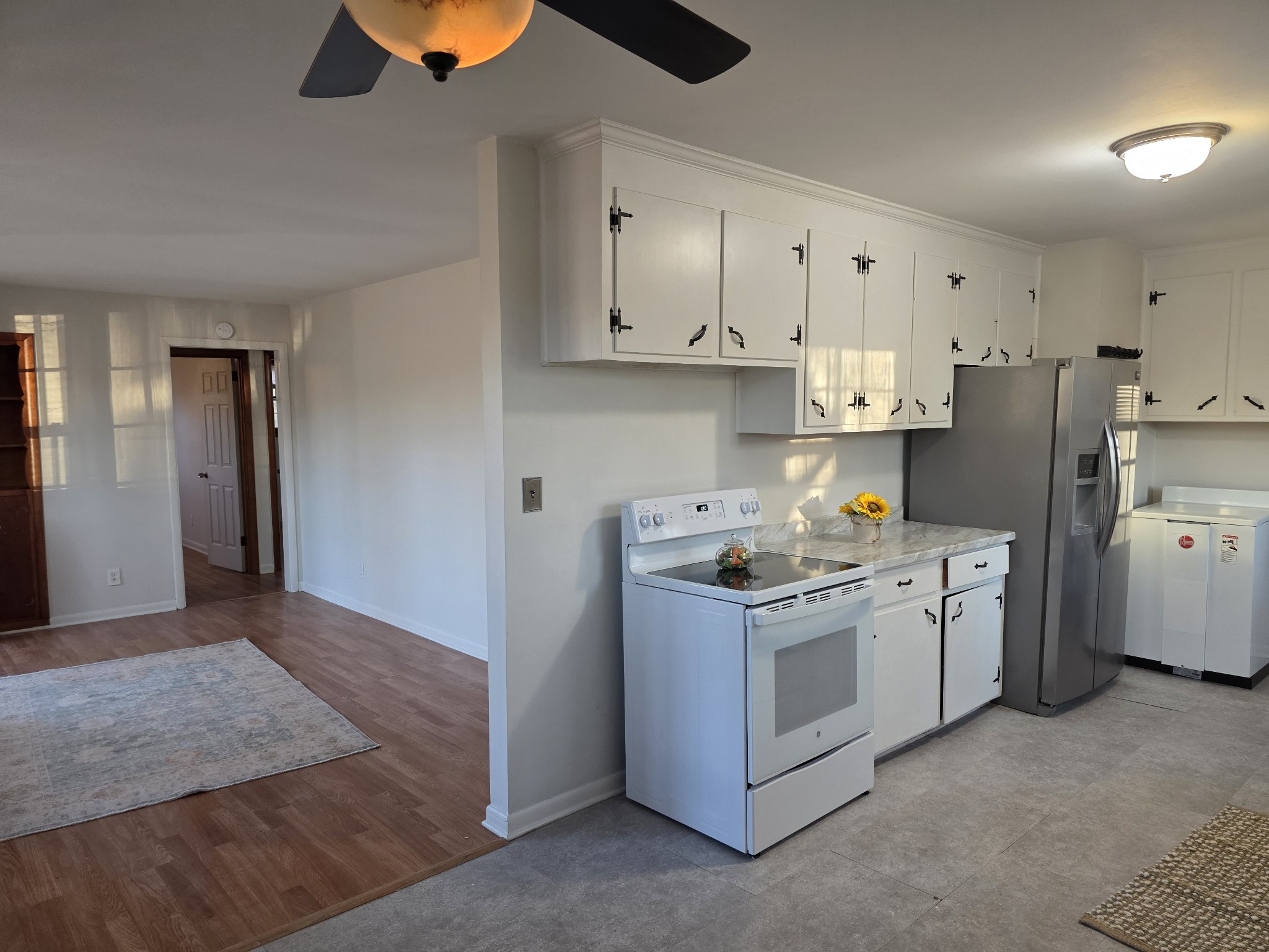 1497 Mt Pleasant Road Kingston Springs, TN 37082 - Photo 8 of 25 a kitchen with stainless steel appliances granite countertop a stove a refrigerator and a sink