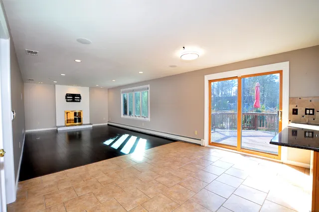 a view of a living room and a balcony