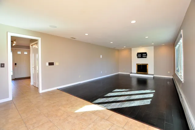 a view of wooden floor and living room