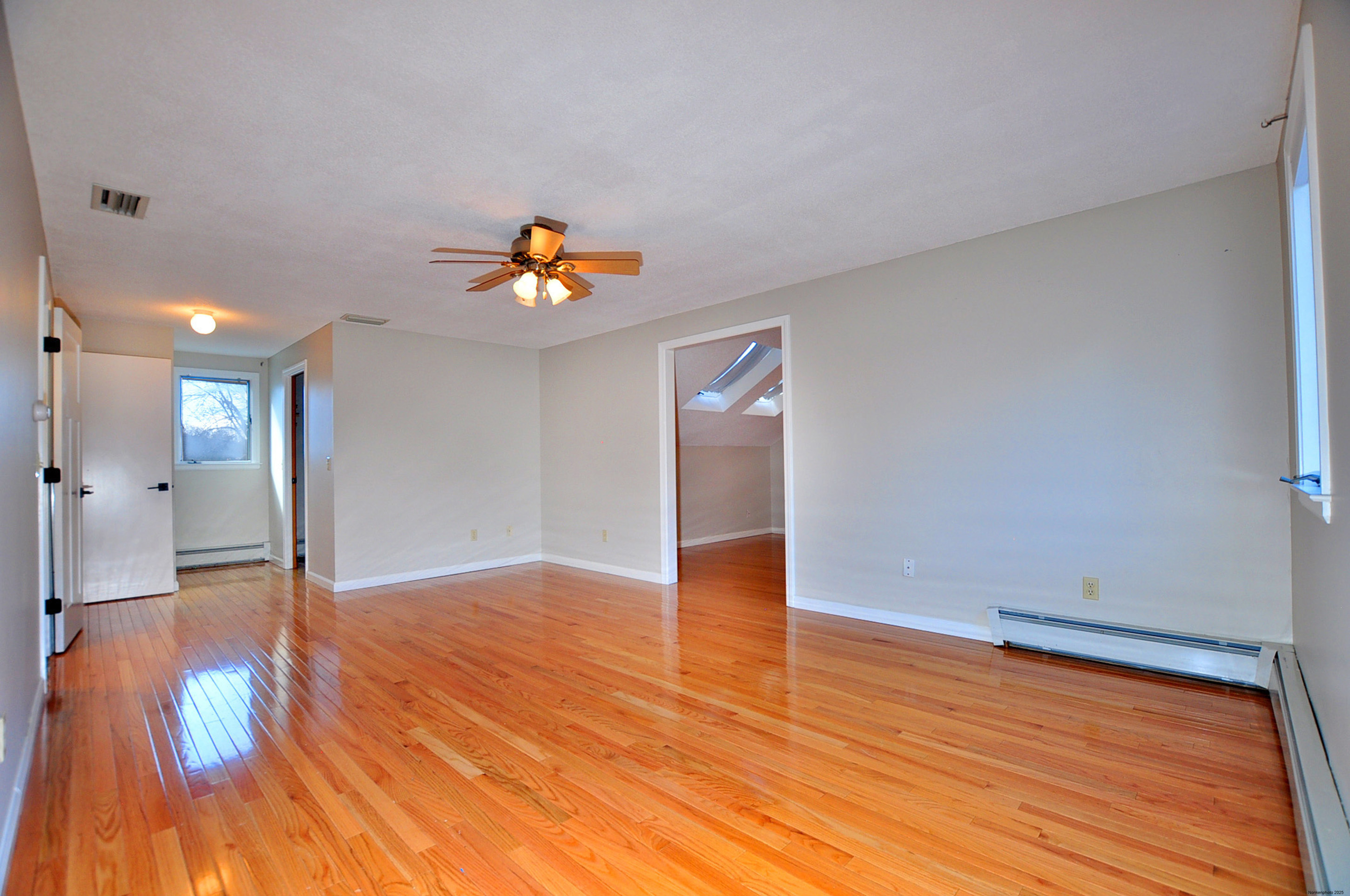 16 Virginia Lane Farmington, CT 06085 - Photo 25 of 40 a view of an empty room and wooden floor