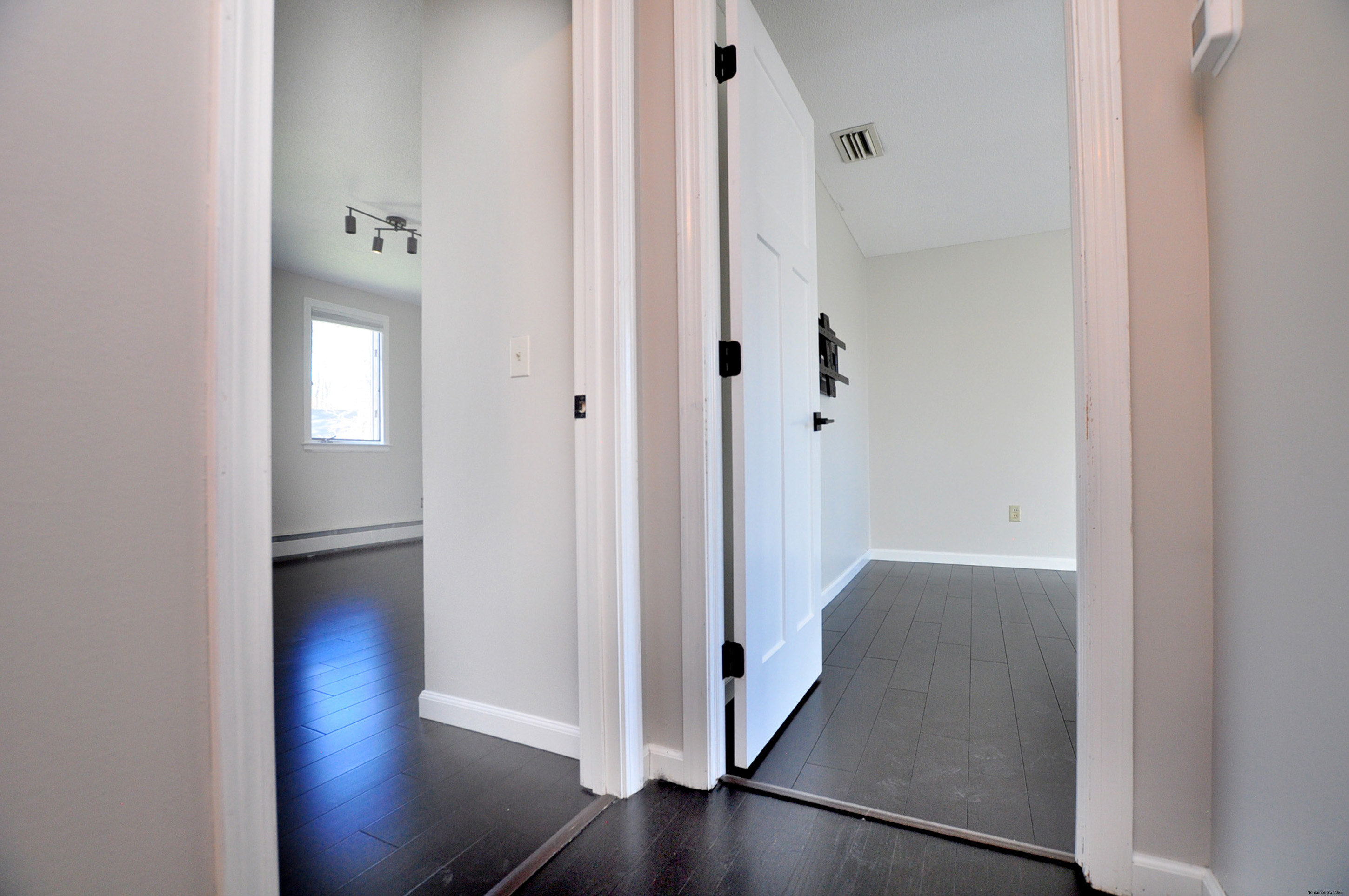 16 Virginia Lane Farmington, CT 06085 - Photo 32 of 40 a view of a hallway with wooden floor
