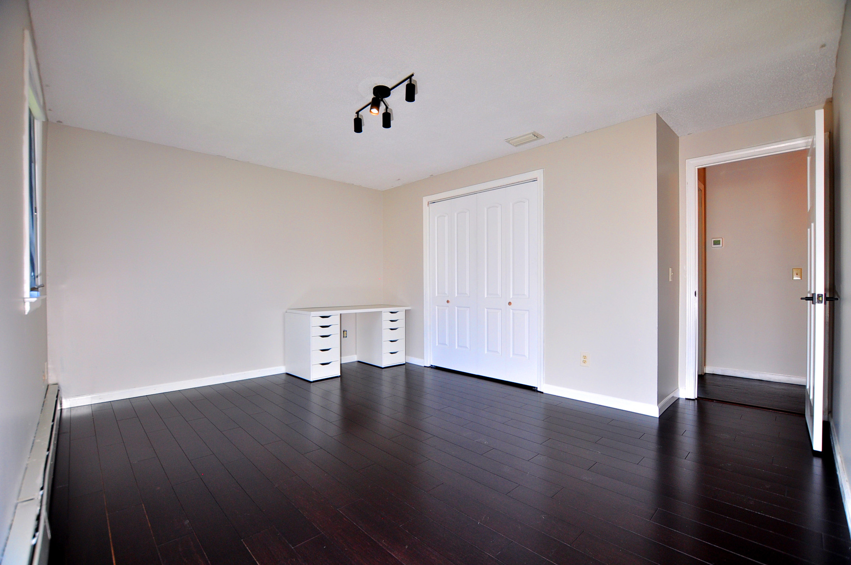 16 Virginia Lane Farmington, CT 06085 - Photo 37 of 40 a view of an empty room with wooden floor