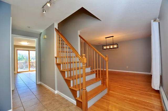 a view of entryway with wooden floor